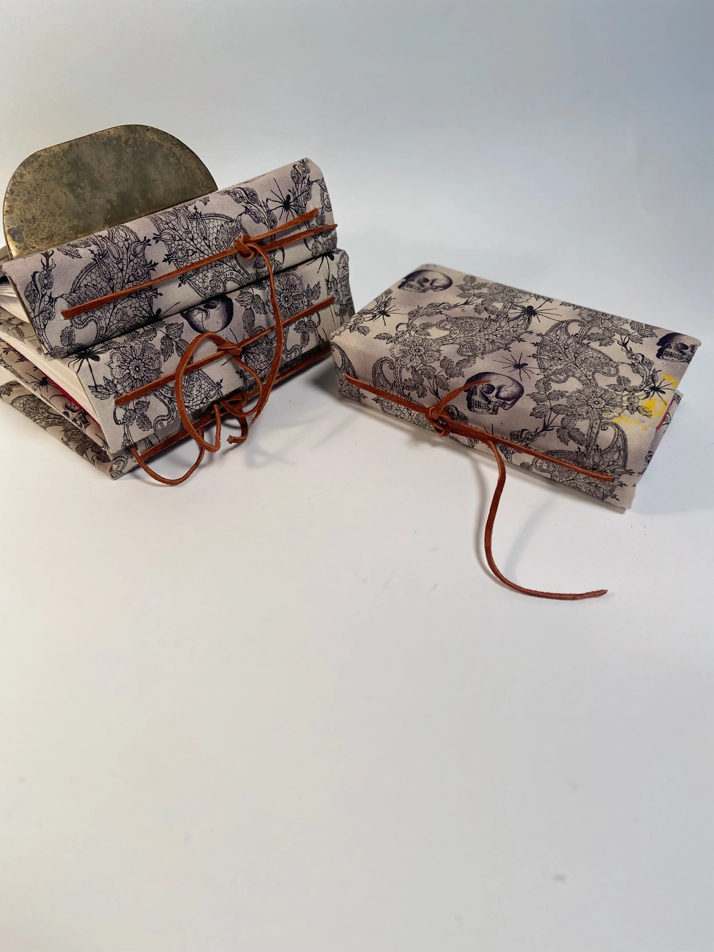 small notebooks.  sketch book paper, gothic skull design
