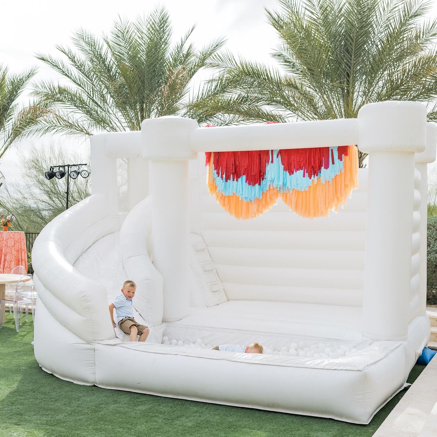 THREE-ESTA 🎉 feat. our White Rapids Waterslide used as a ball pit with our red, blue and orange fringe, our Oliver kids table paired with Annie kids chairs, and last but not least our 8x8 Bitty Bouncer! Taco bout a party!!! 🤭🌮 We are throwing our 