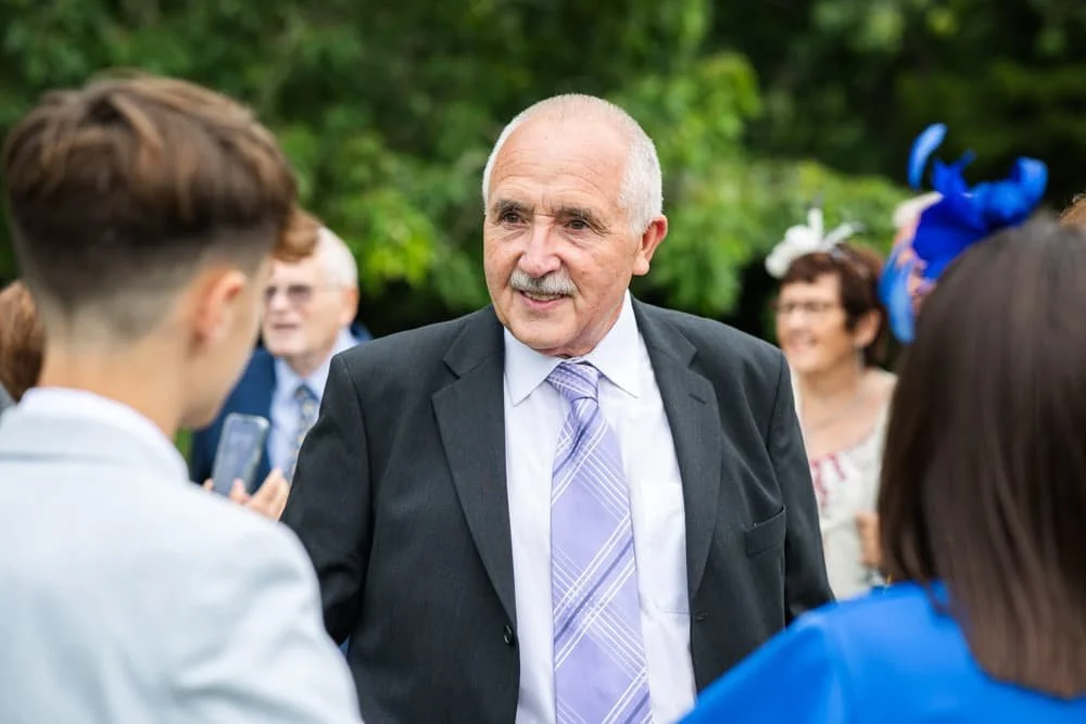 candid photo of guest at manor house wedding