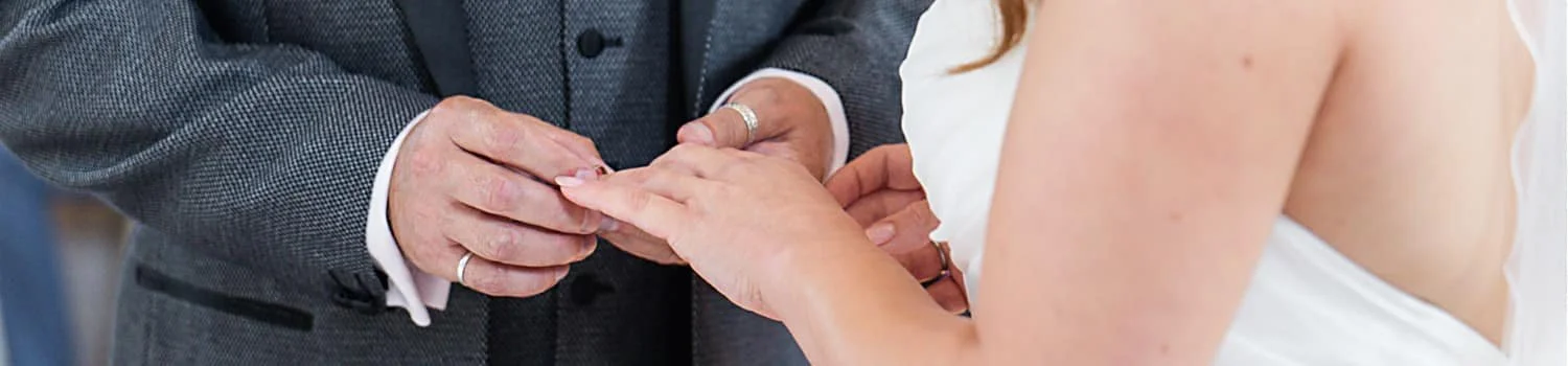 exchanging rings during ceremony at GreyFriars Colchester