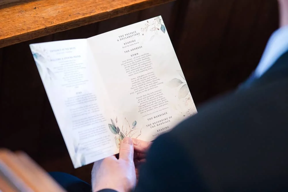 wedding order of service in guests hand