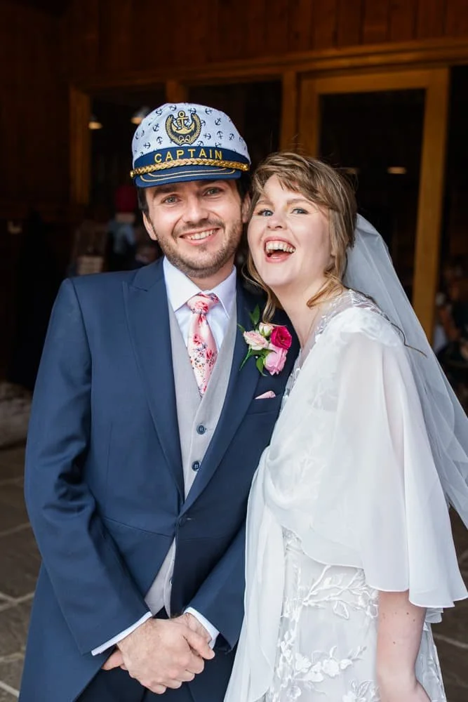 groom wearing caption fancy dress cap