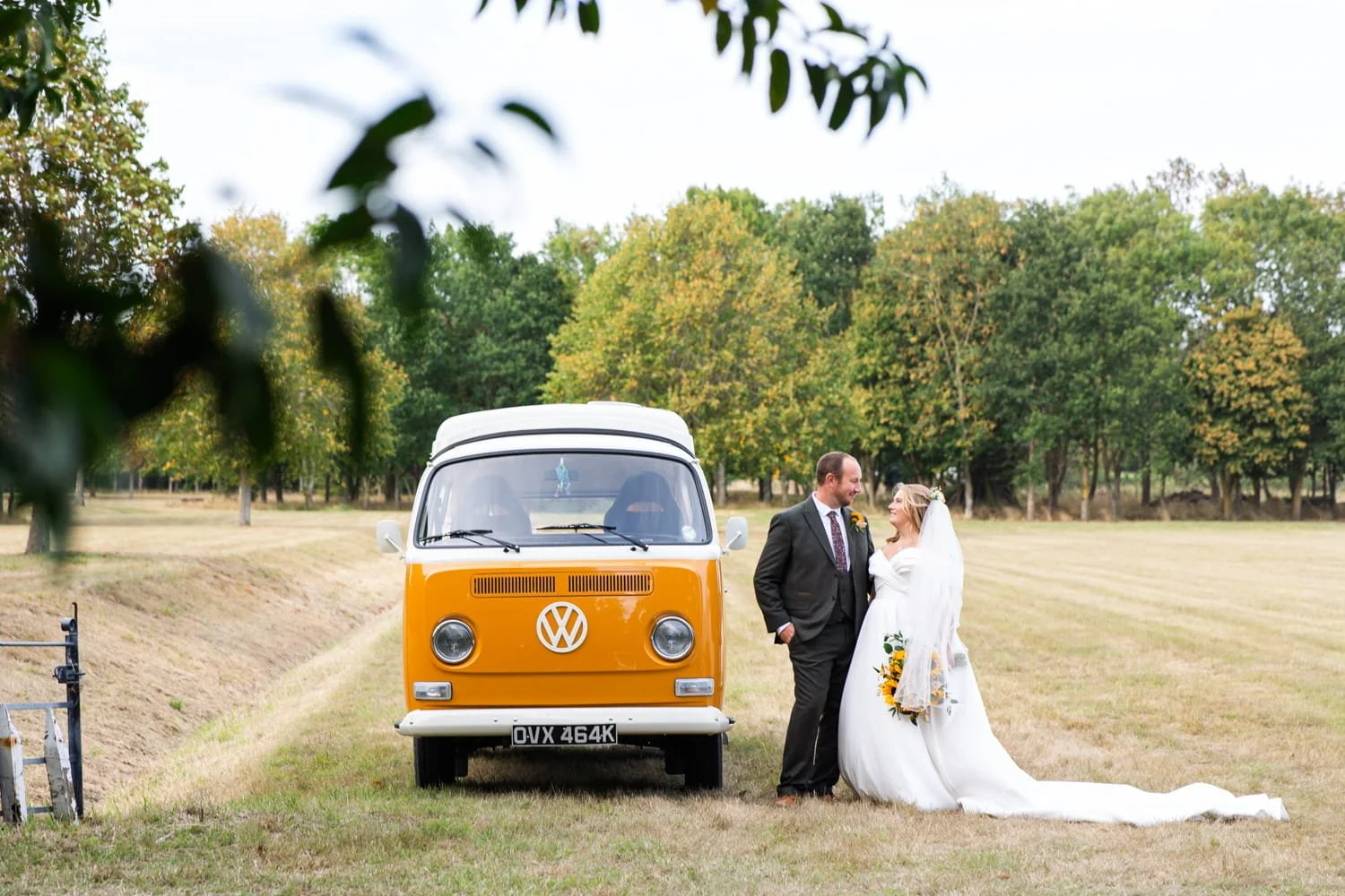 wedding couple with VW campervan at diy wedding