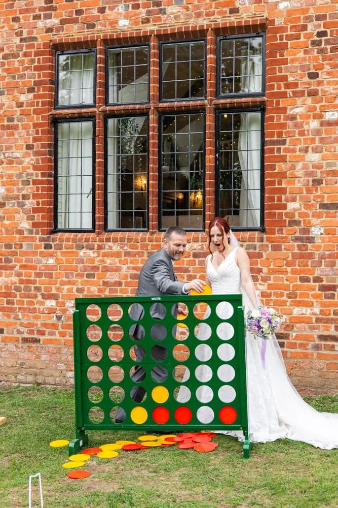 bride and groom playing giant connect 4