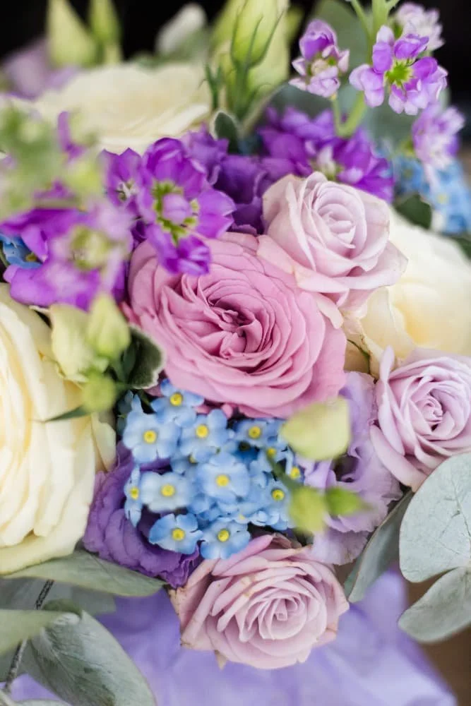 gorgeous pink and blue flowers in wedding bouquet