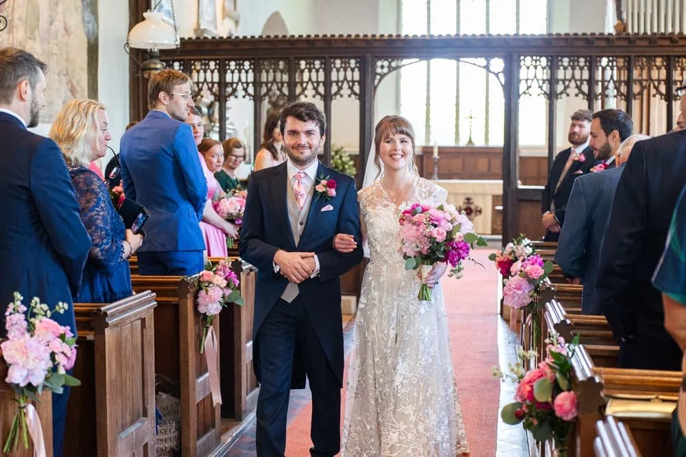 bride and groom leaving wedding ceremony