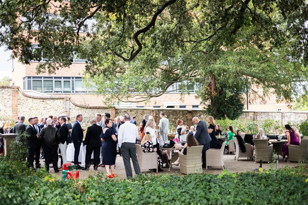 Guests gathered under tree for Greyfriars drinks reception