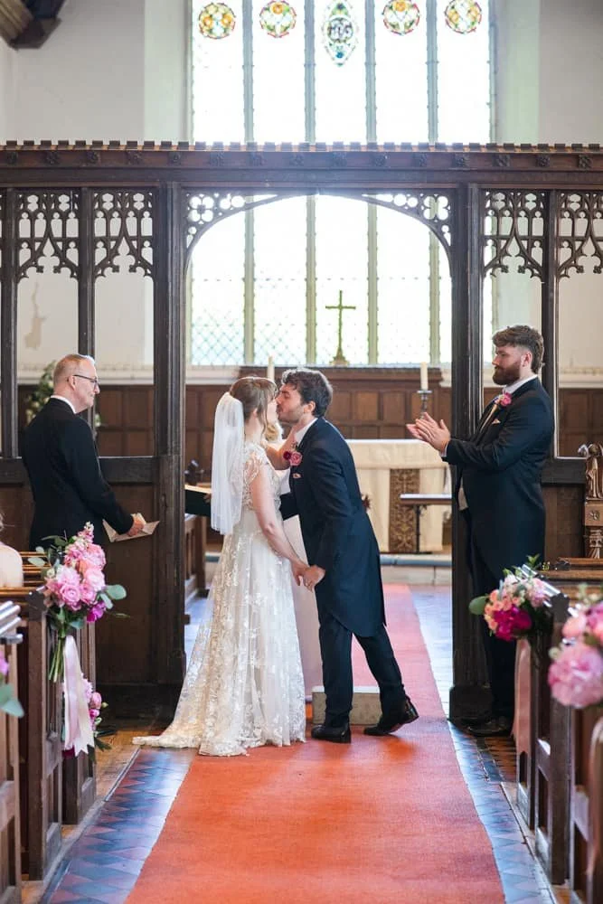 first kiss at church wedding ceremony
