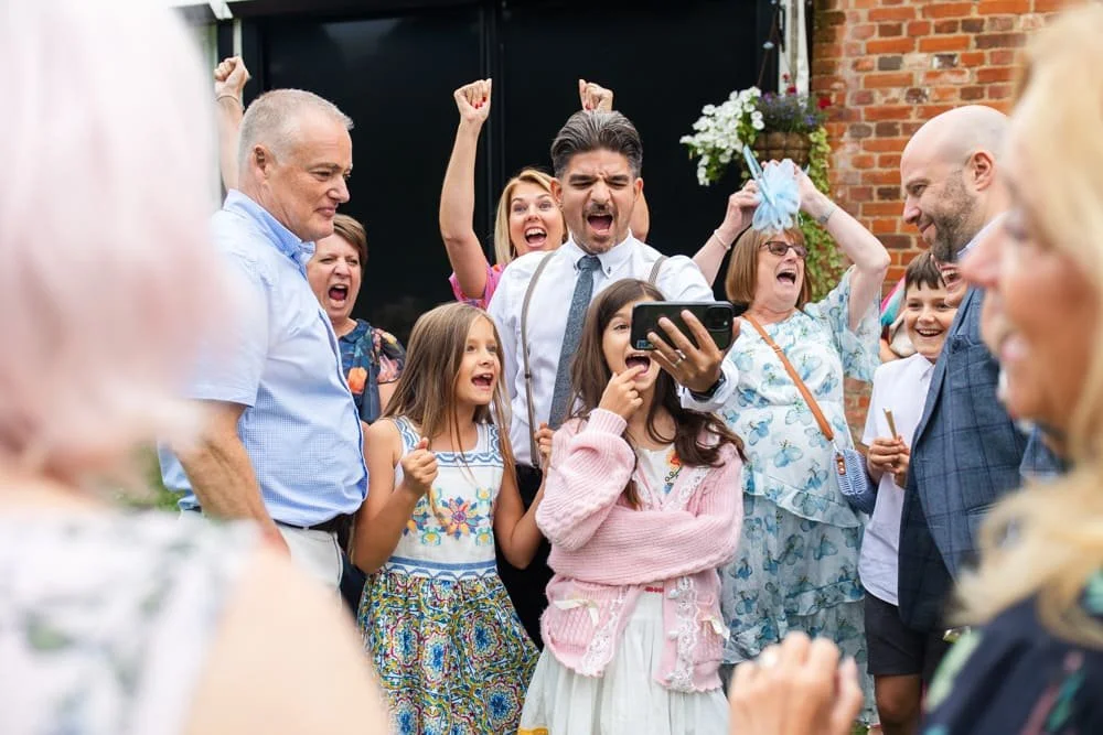 guests watching football on phone