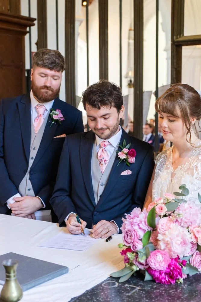 groom signing the register