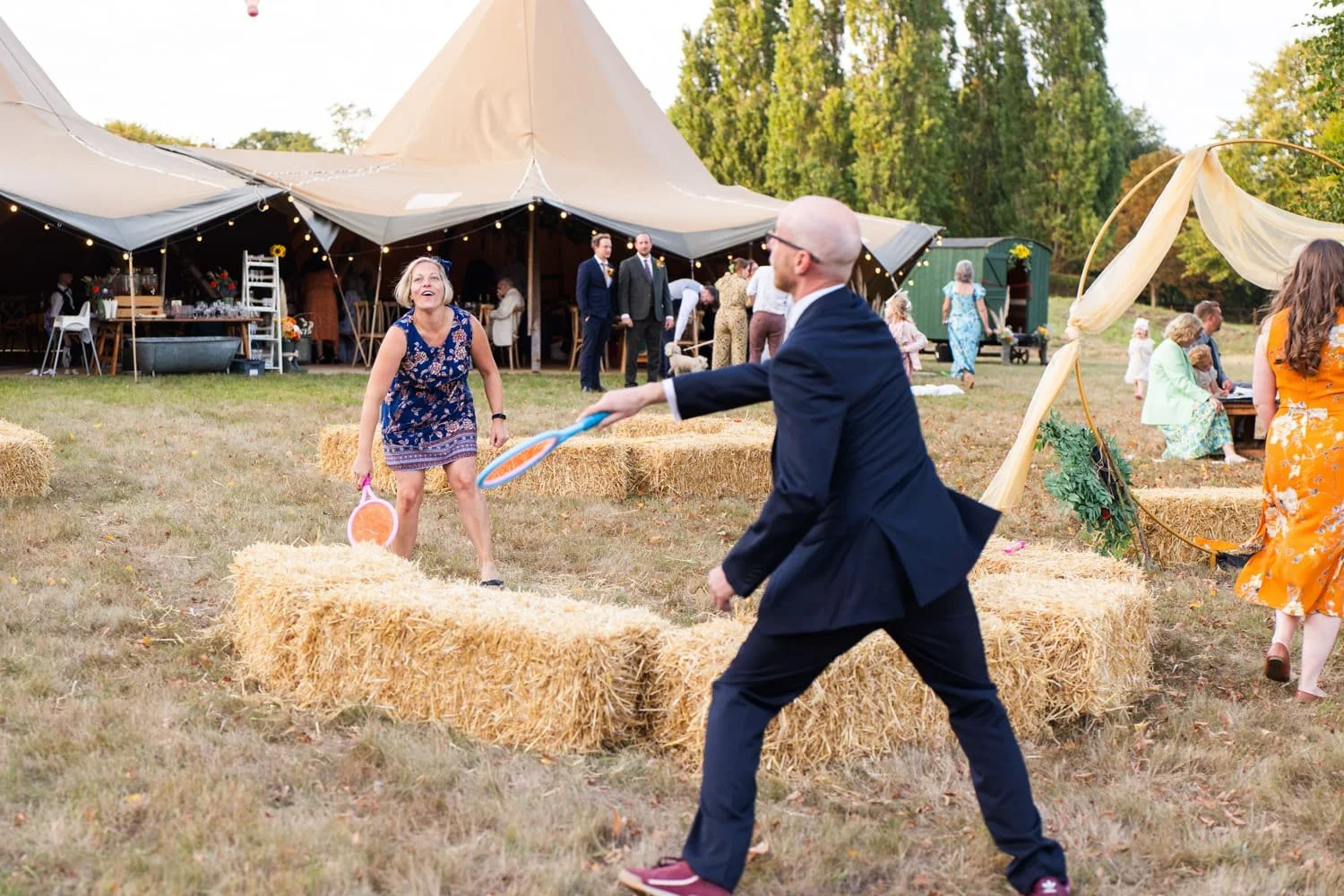 guests playing games at diy tipi wedding