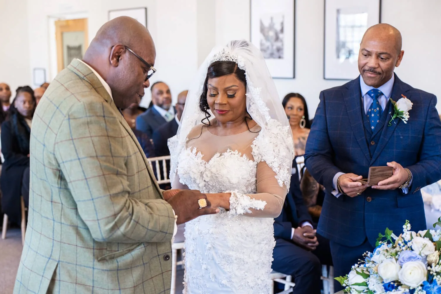 mature couple exchanging rings at Bury St Edmunds registry office wedding