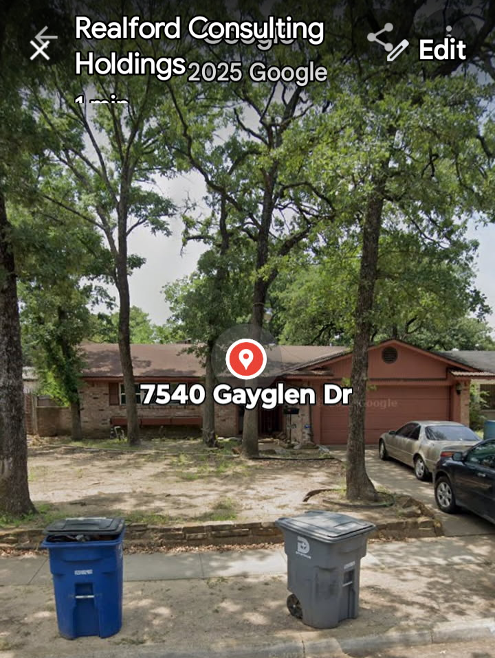 A row of trees in a residential area with a house in the background, two garbage bins on the sidewalk, and parked cars.