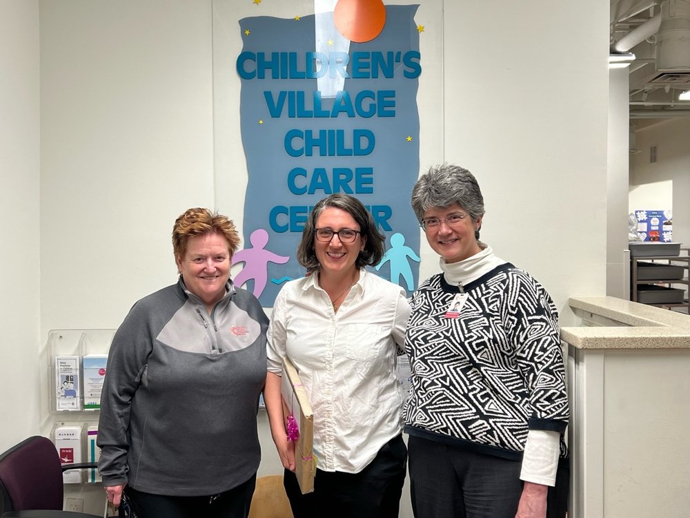 (l to r) Mary Graham, Ex. Dir.; Elinore Kaufman; and Beth Baker, Dir. Family Services