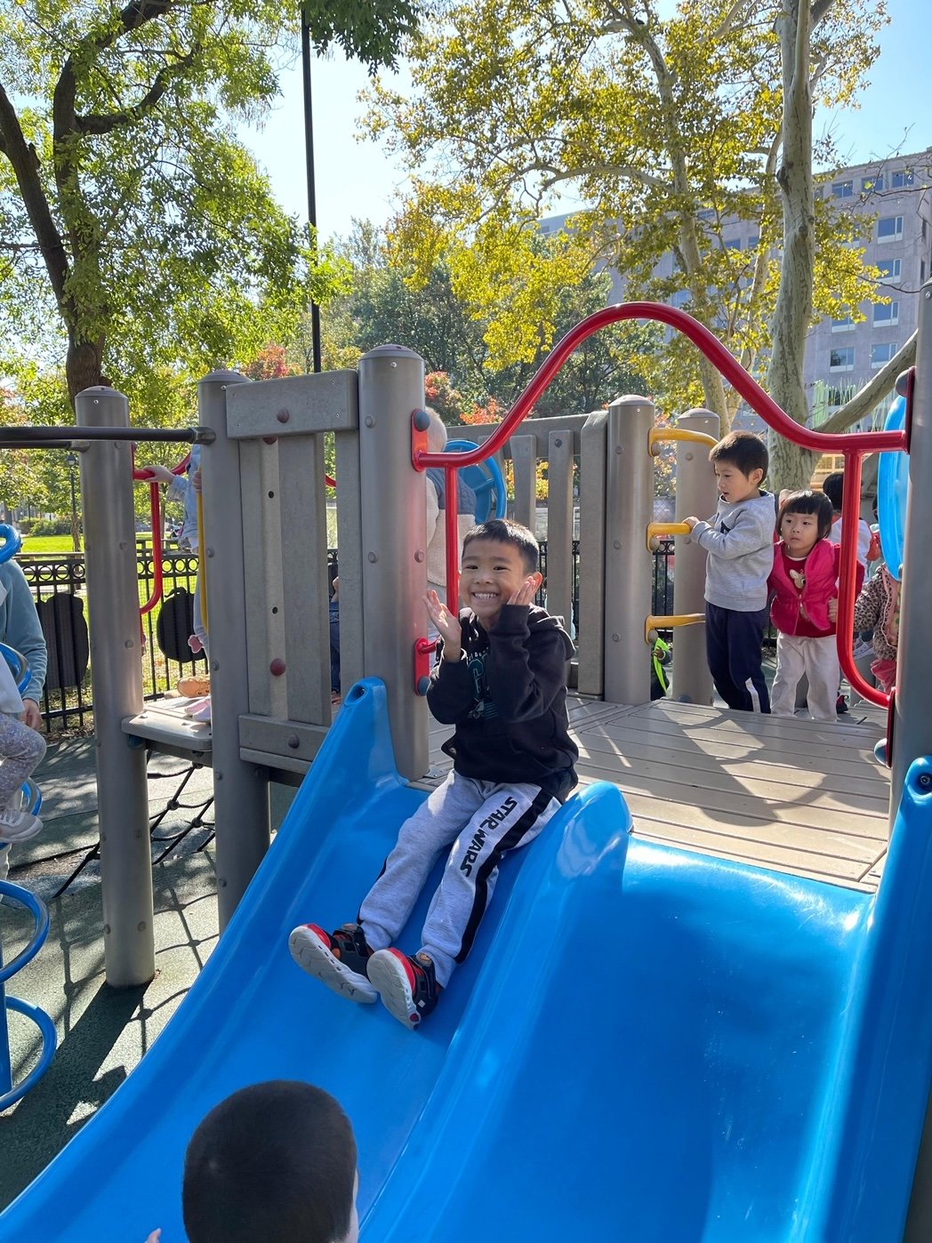 Happy boy on slide.JPG