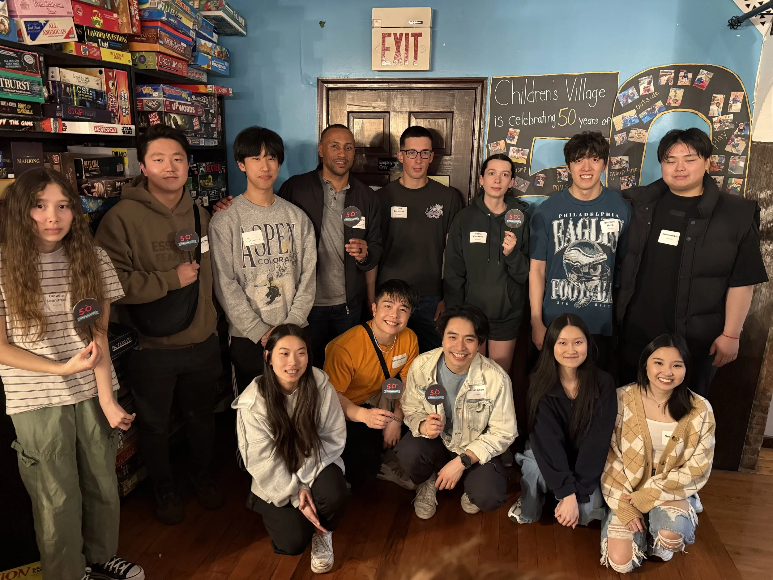 A group of alumni pose for a photo.