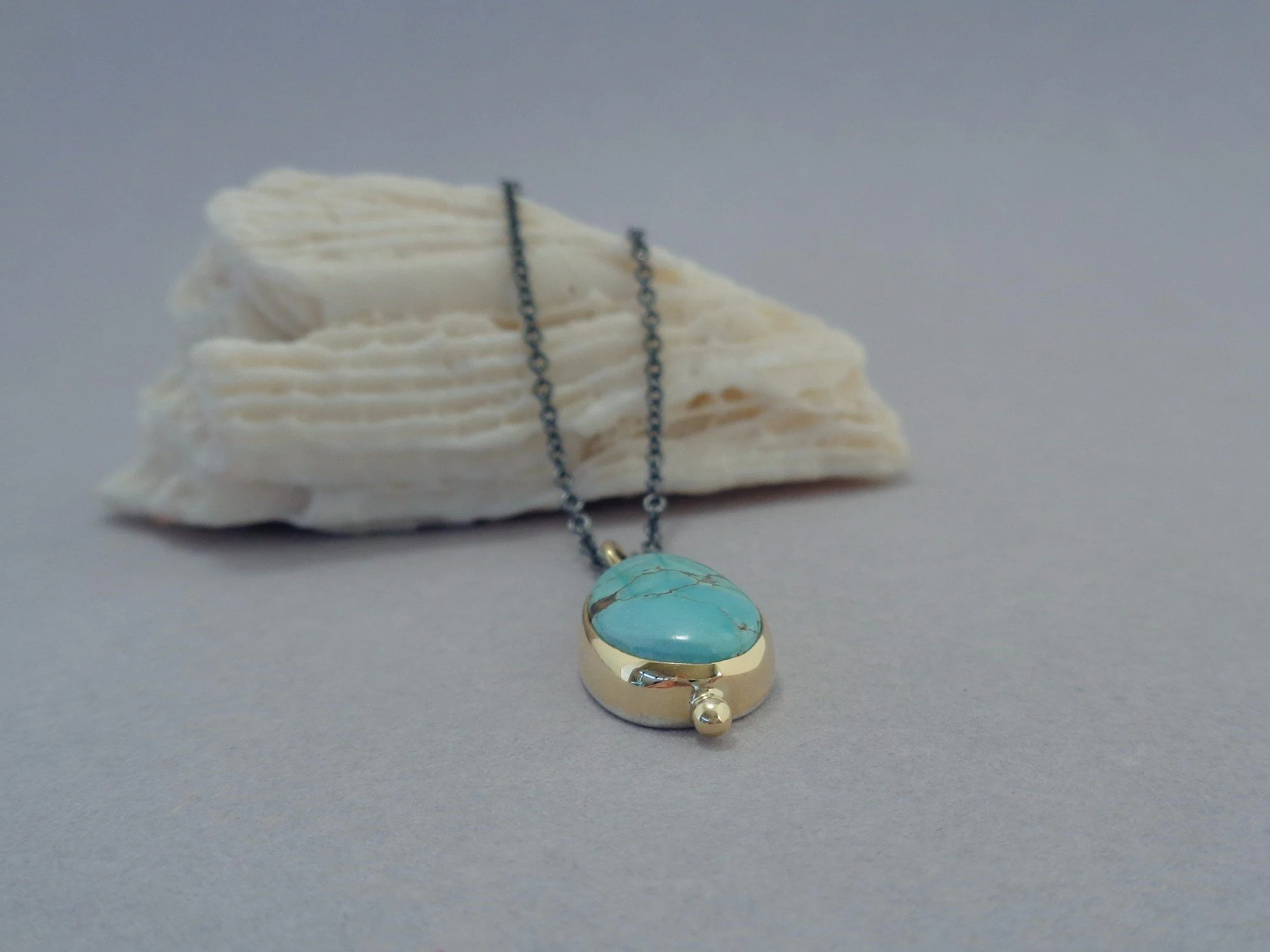 gold pendant with turquoise x.jpg