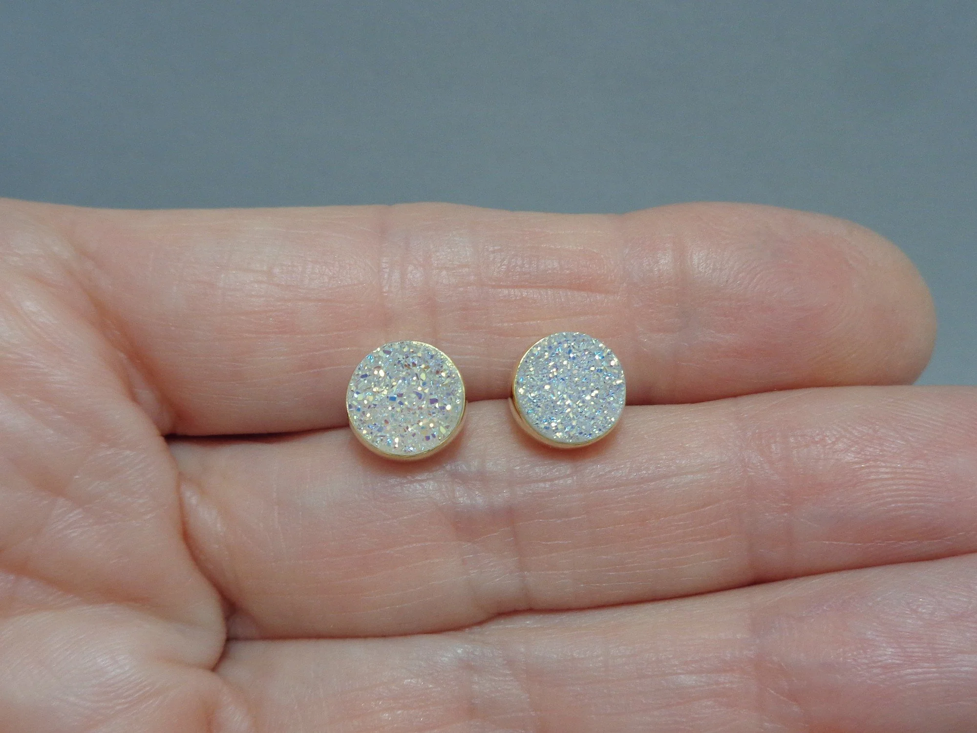 white rainbow studs x.jpg