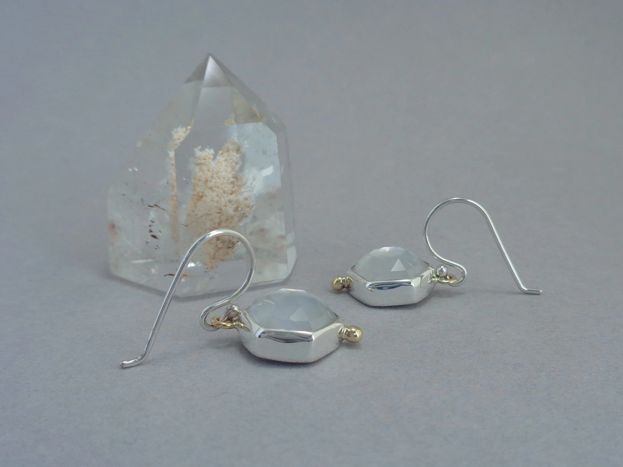 silver and gold earrings with white MOP x.jpg