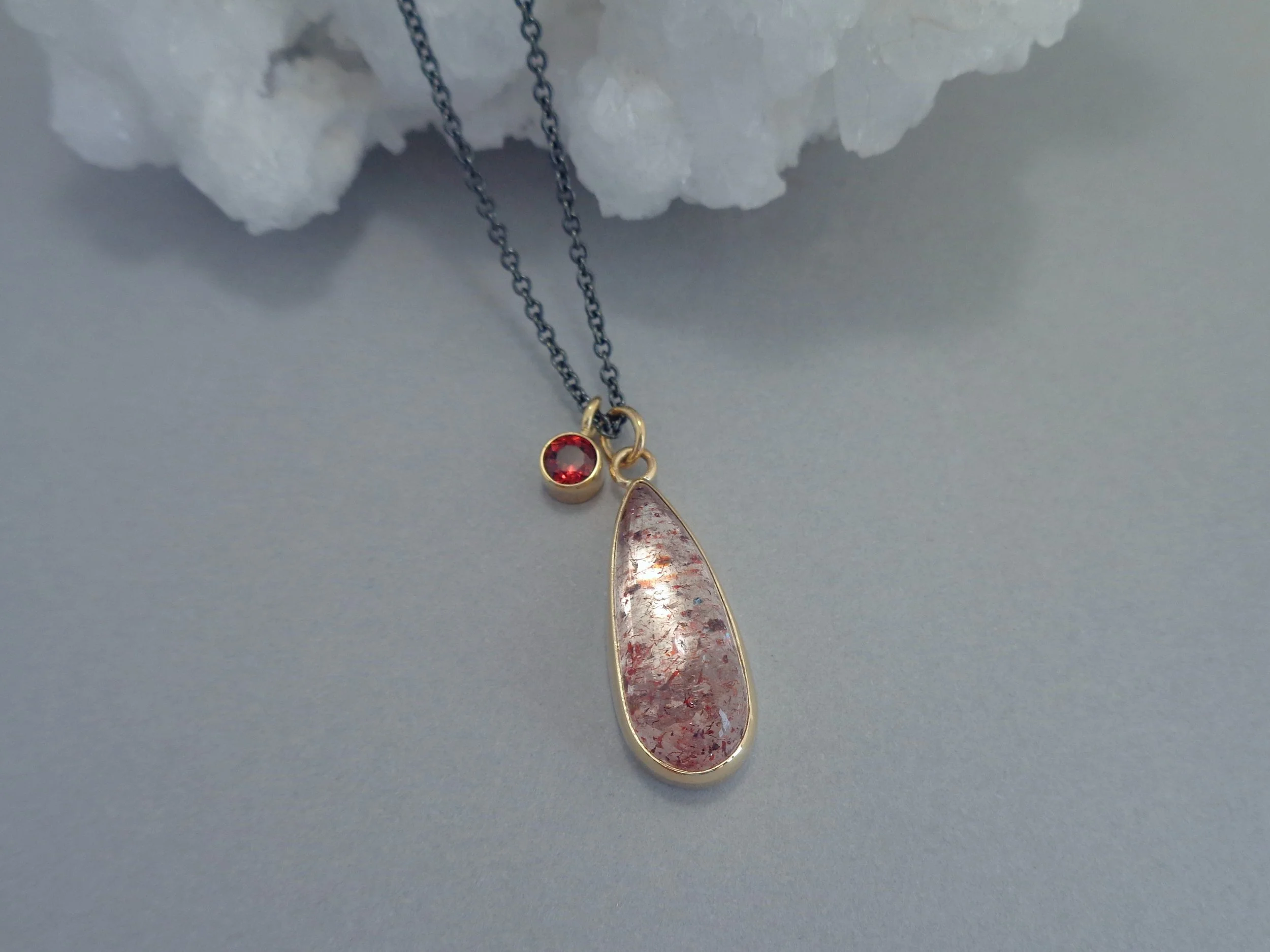 pendant with hematite in quartz and garnet.jpg