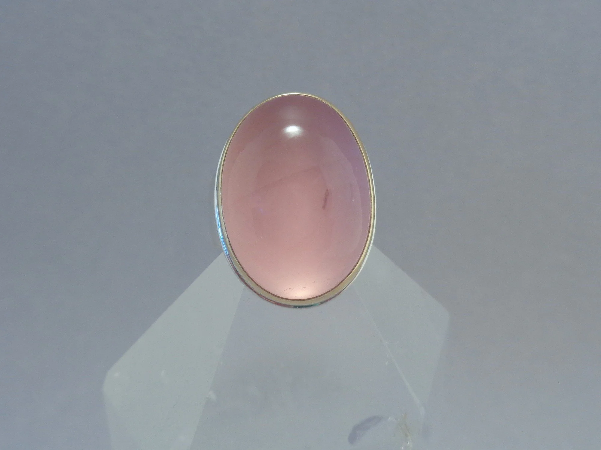 rose quartz in mixed metal ring x.jpg