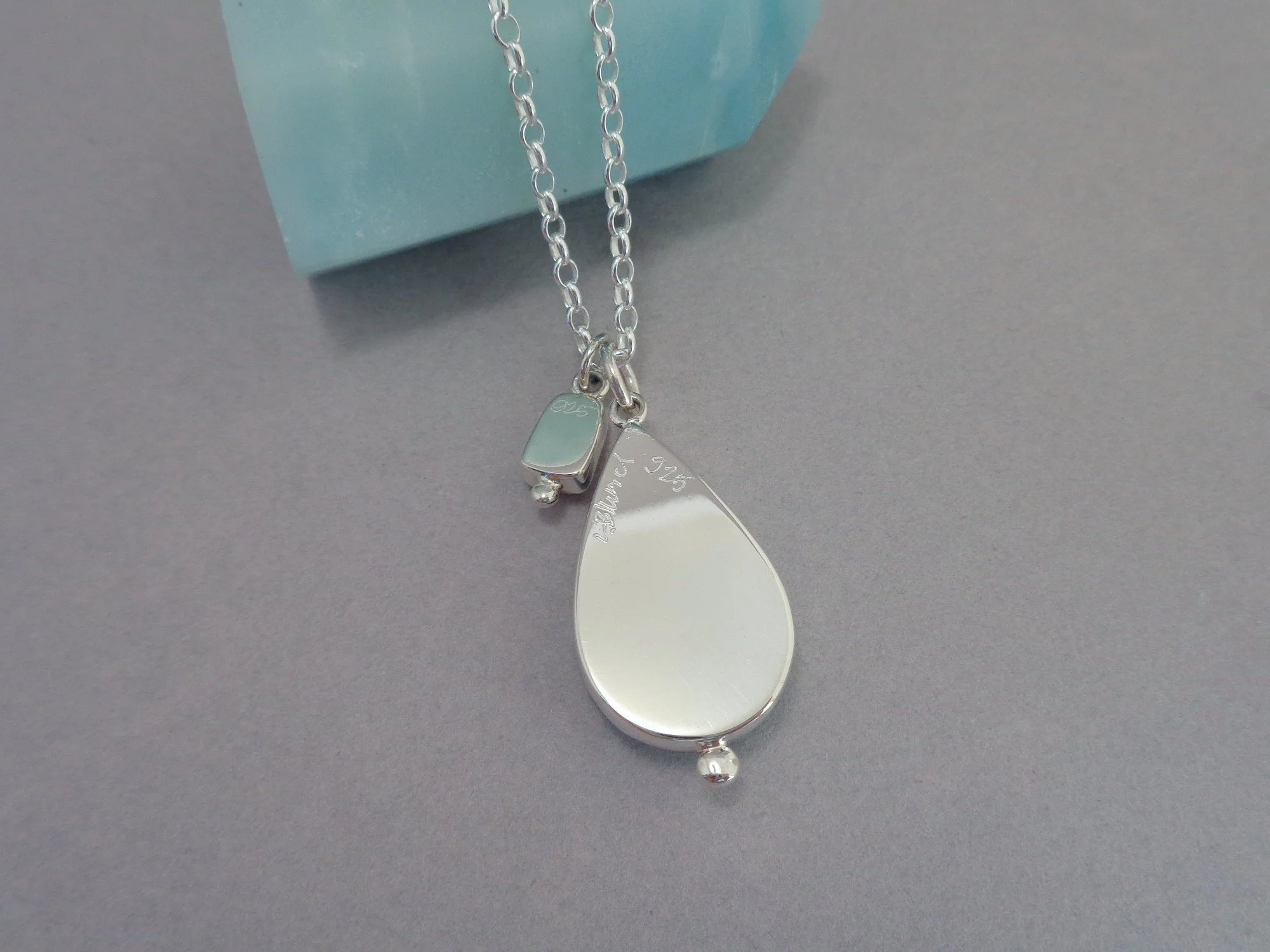 sterling silver pendant with two stones x.jpg