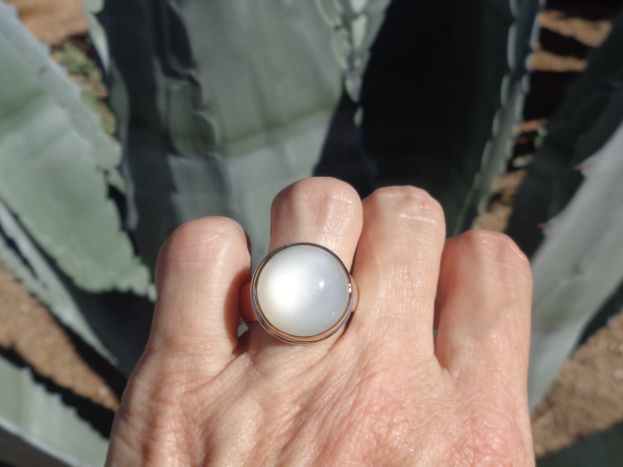 ring with round white moonstone x.jpg
