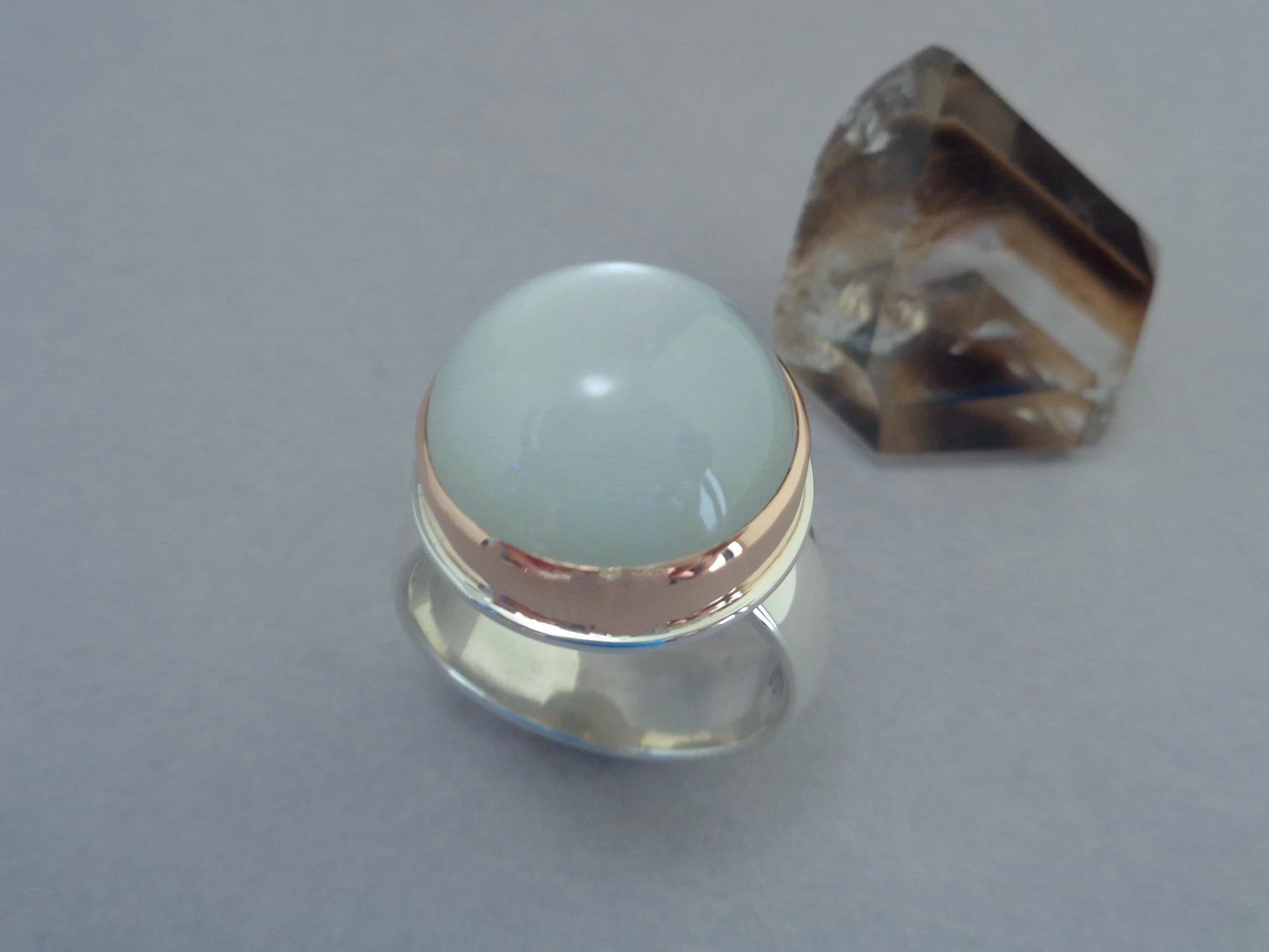 rose gold and silver ring with white moonstone x.jpg