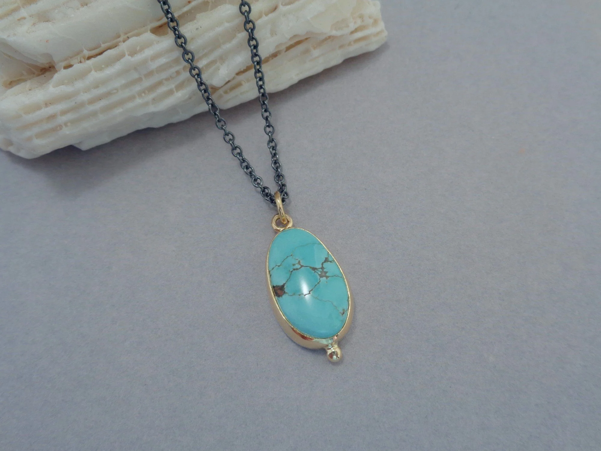 turquoise pendant in 18k gold x.jpg