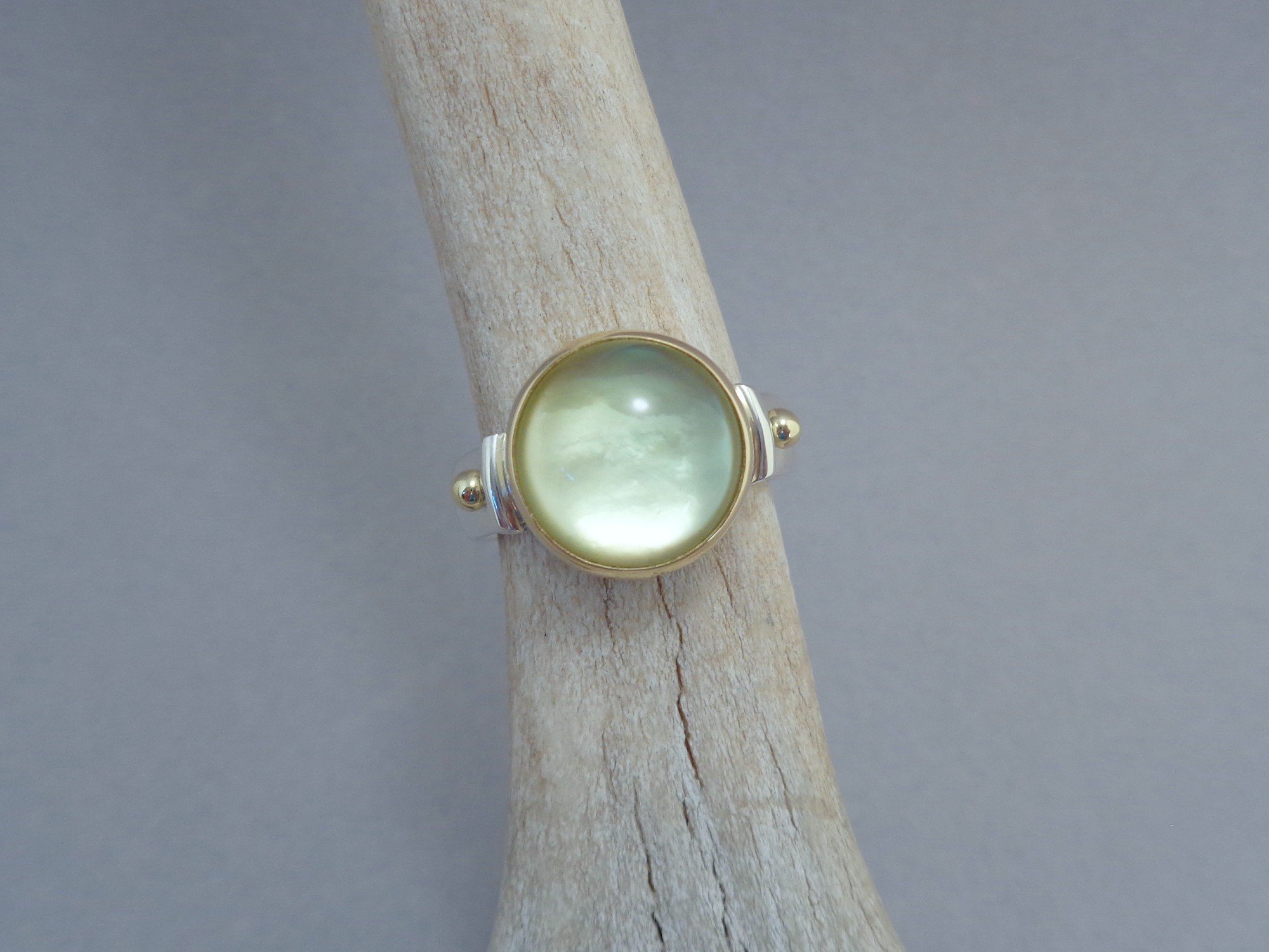 gold and silver ring with yellow gemstone x.jpg