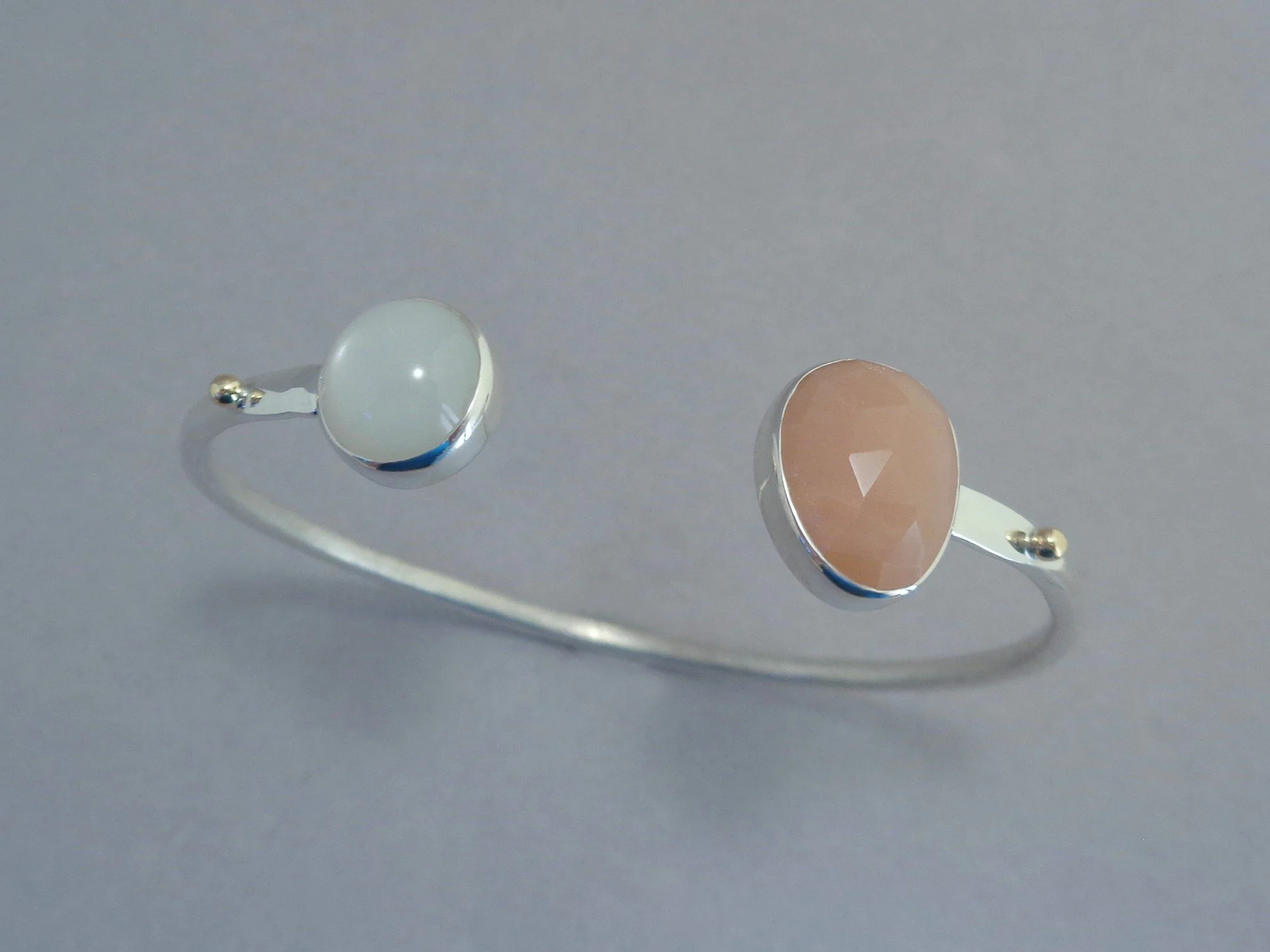 cuff bracelet with peach and white moonstones x.jpg