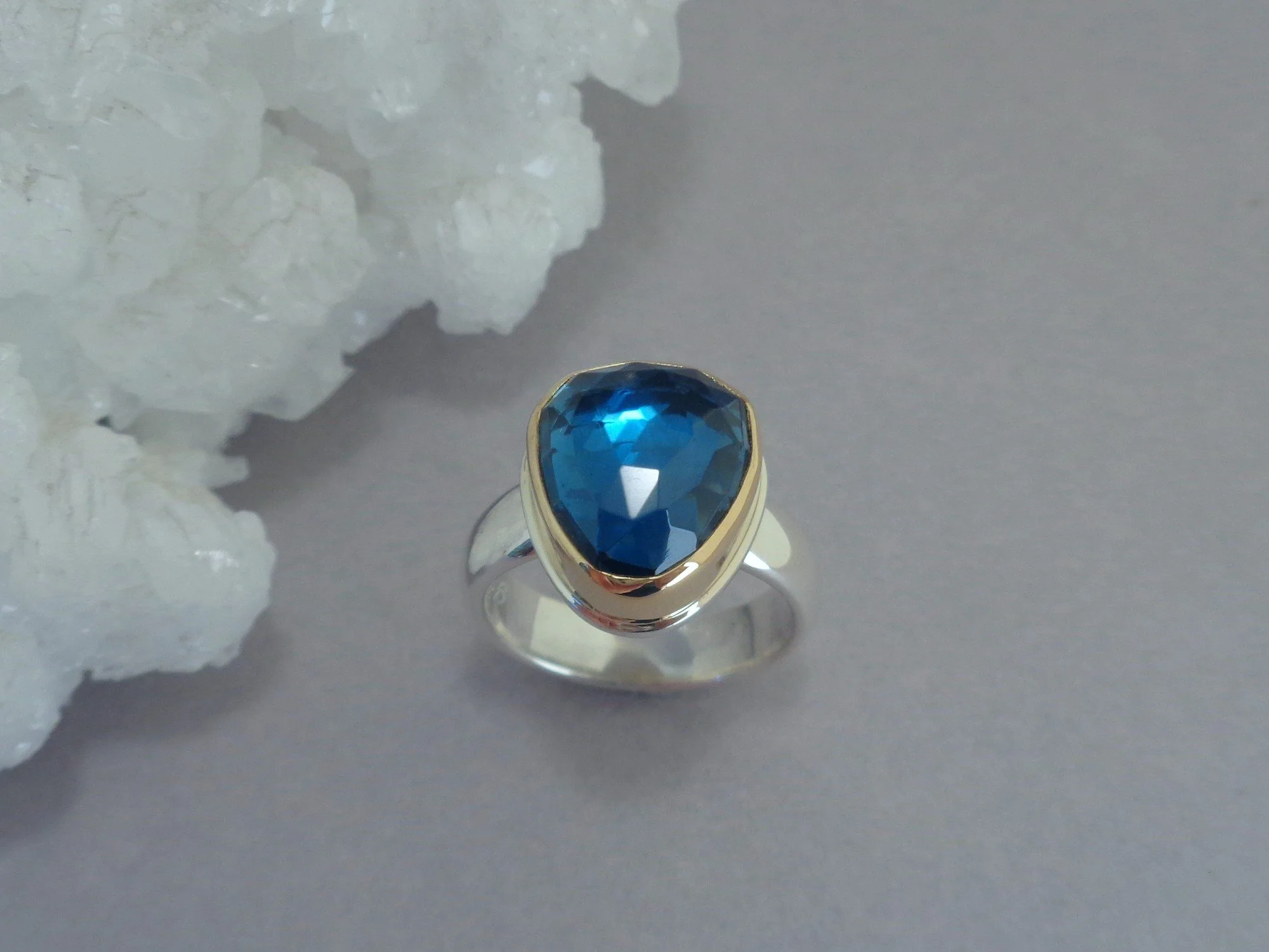 glowing blue topaz ring x.jpg