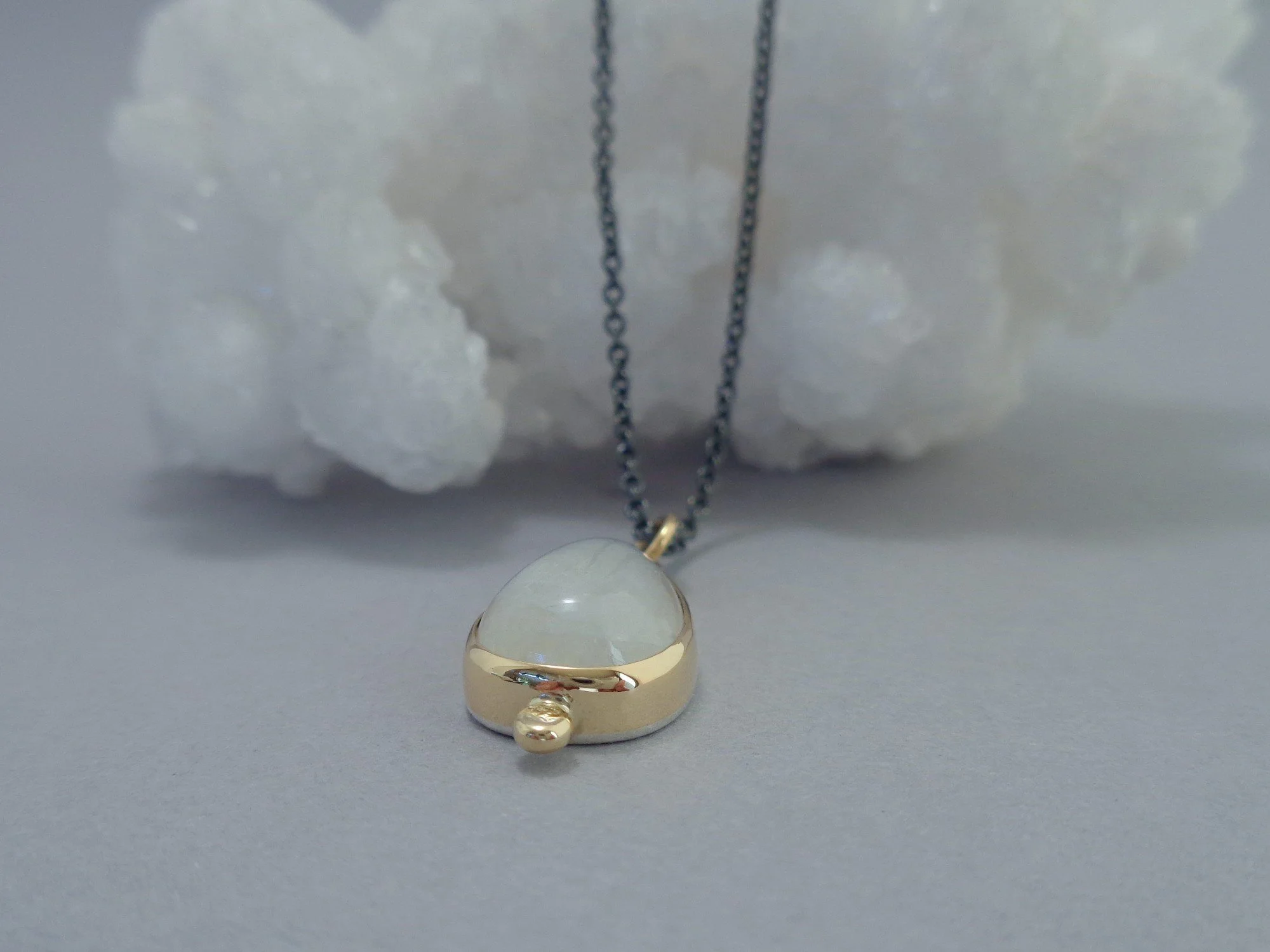 moonstone in gold and silver pendant x.jpg