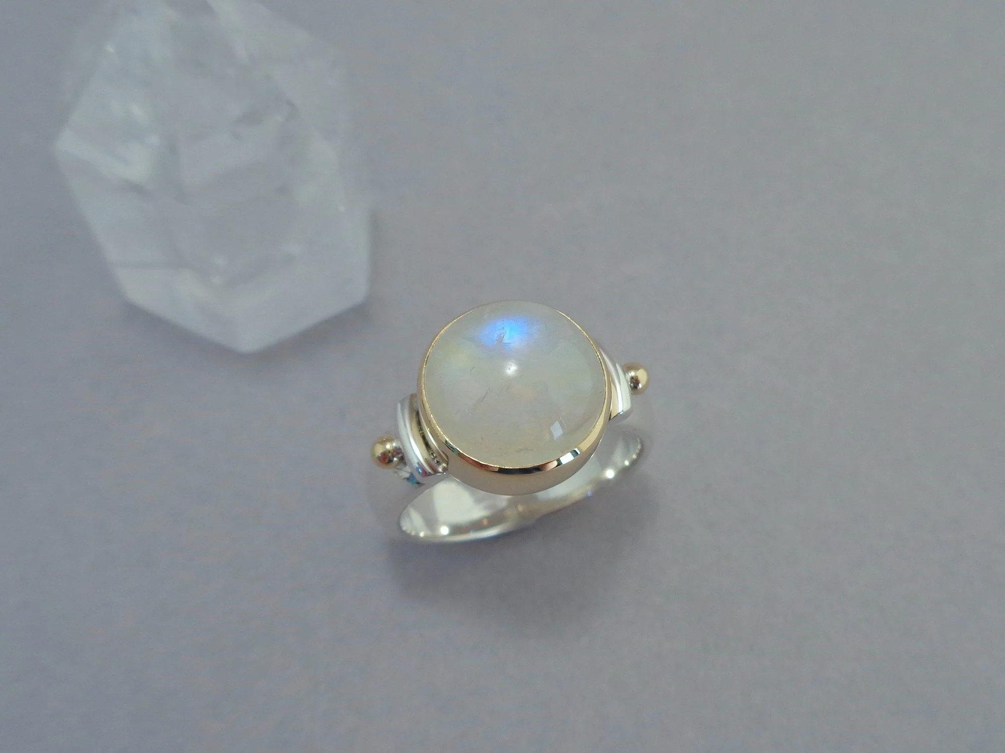 gold and silver ring with rainbow moonstone x.jpg