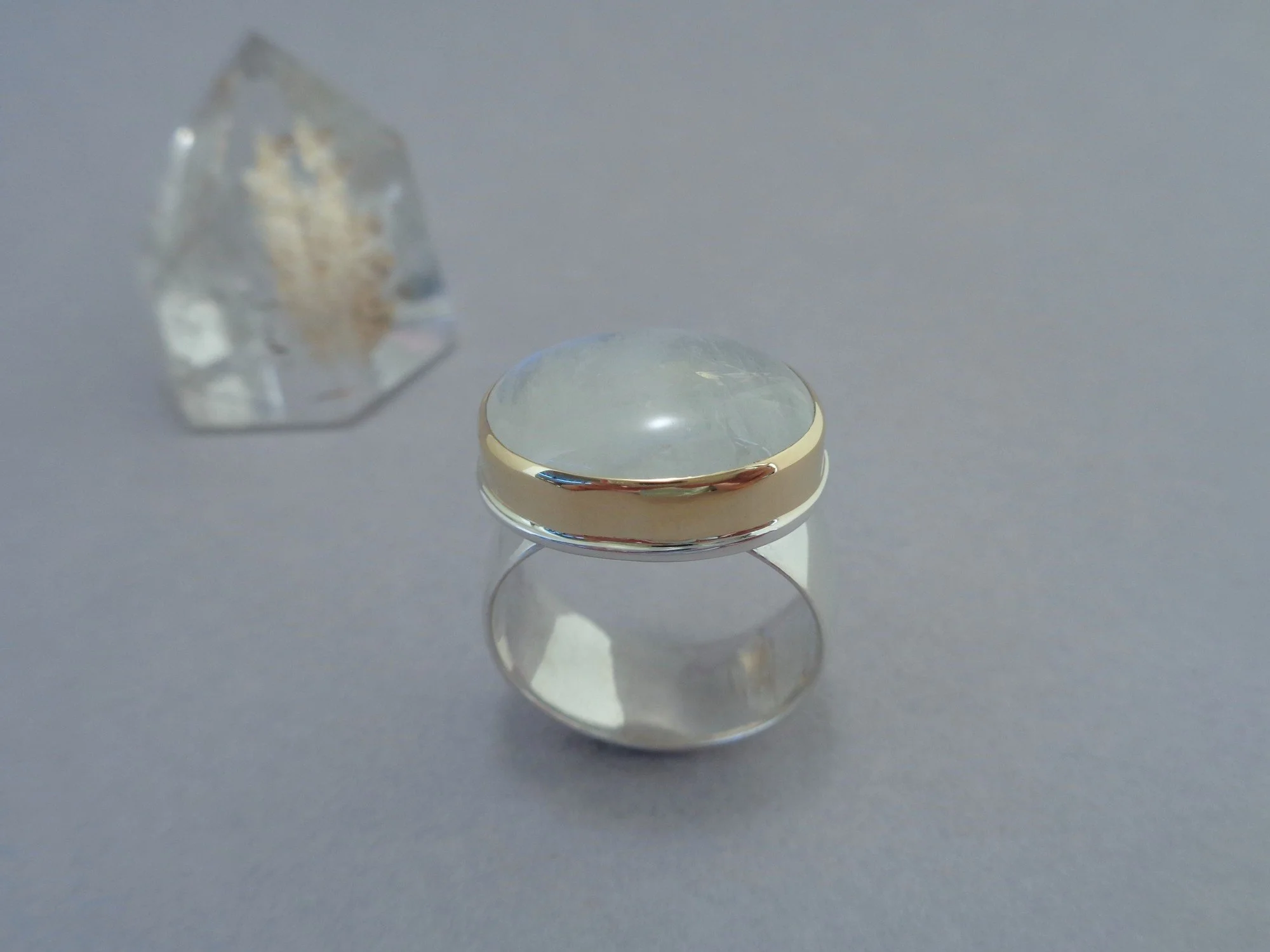 gold and silver ring with rainbow moonstone x.jpg