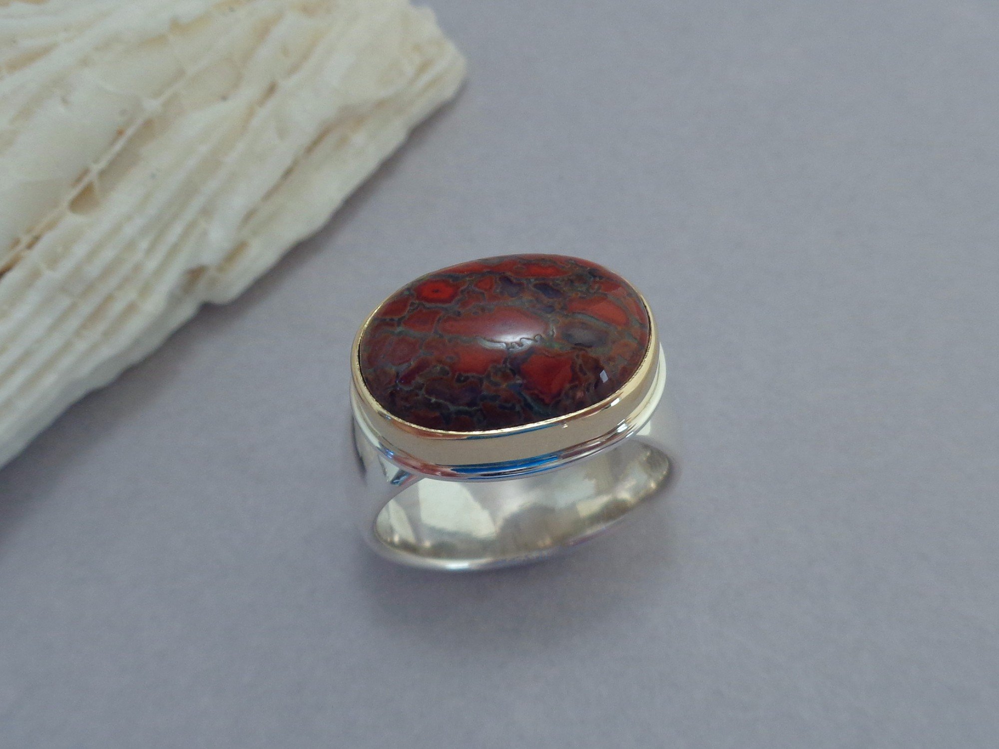 red petrified dinosaur bone ring x.jpg