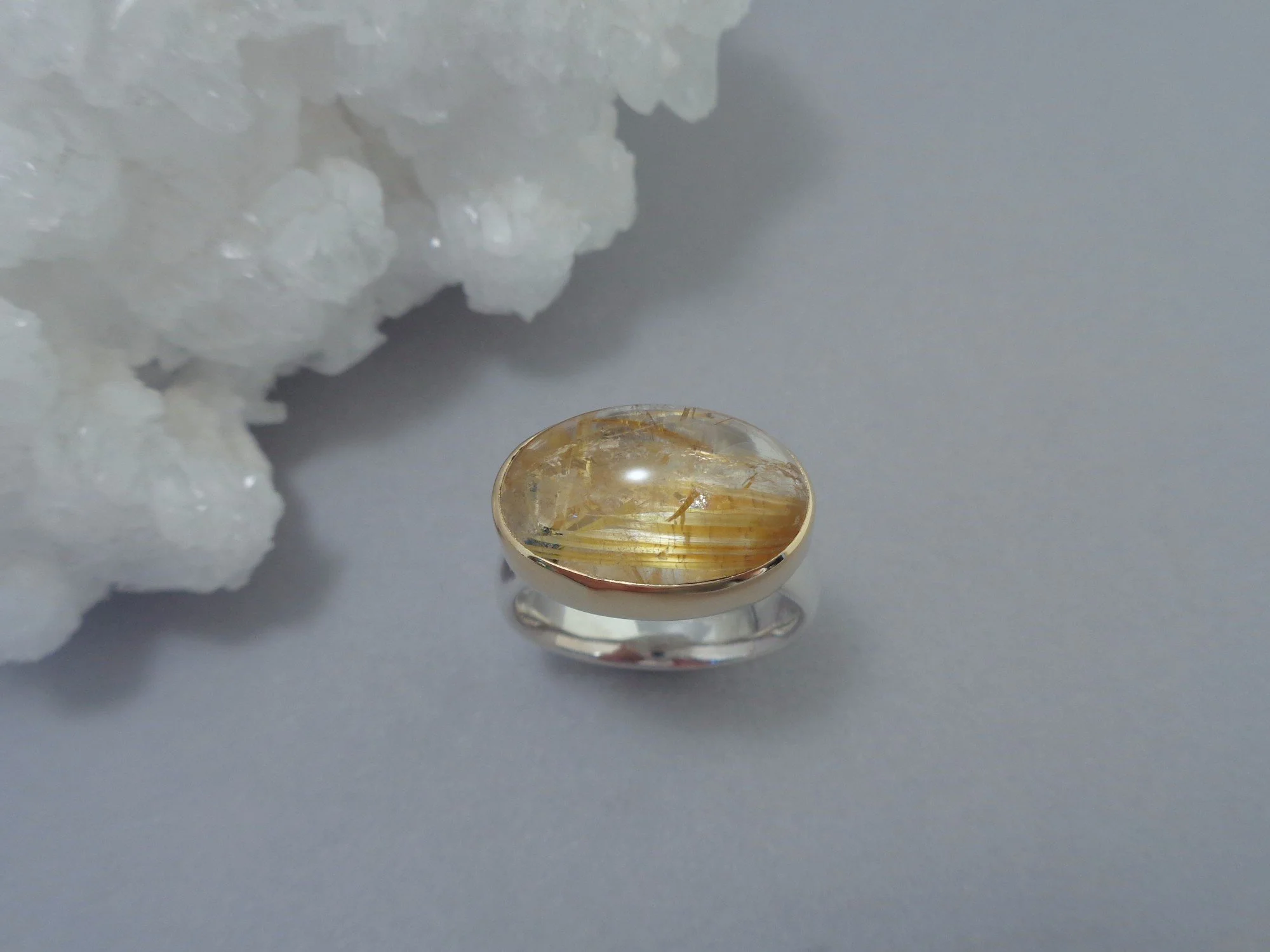 rutile in quartz ring x.jpg