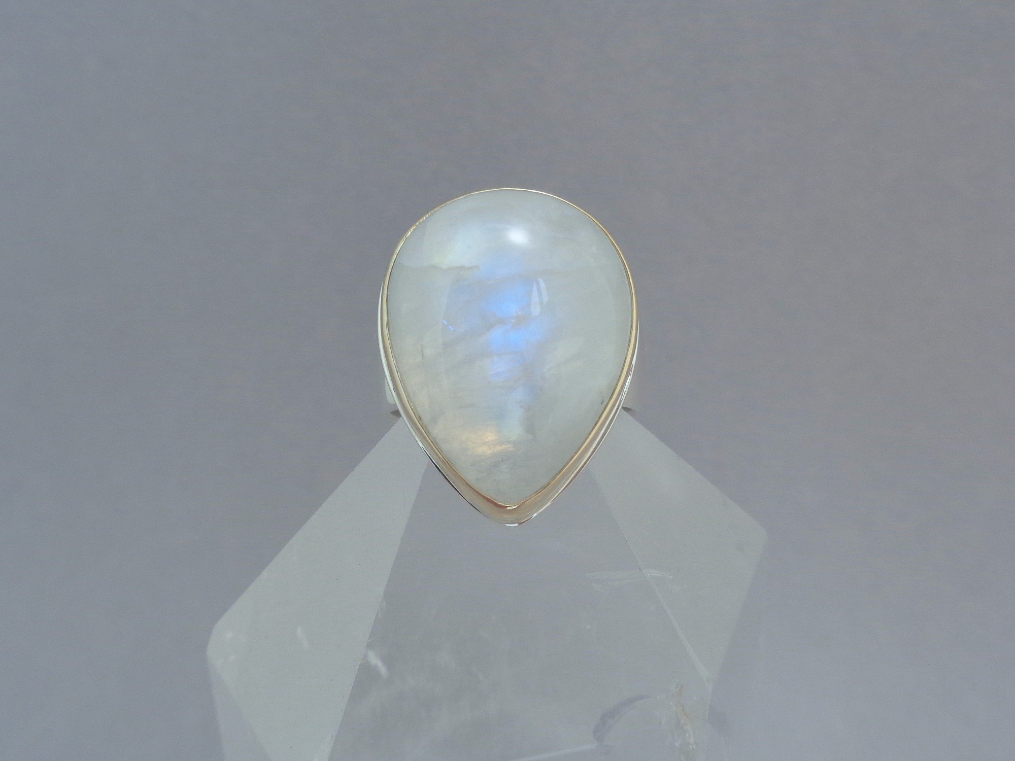 gold and silver ring with rainbow moonstone x.jpg