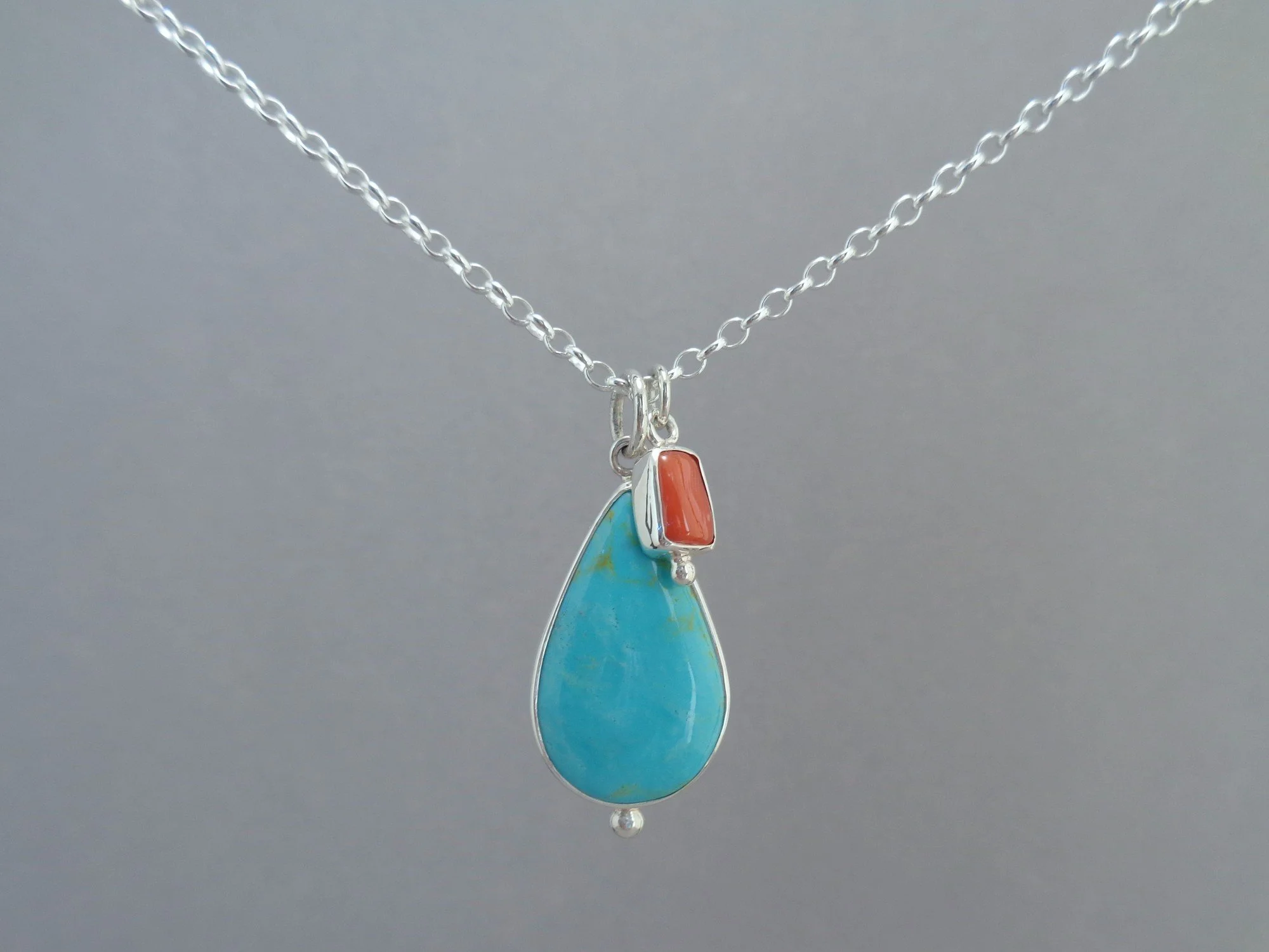 teardrop turquoise pendant with red coral x.jpg