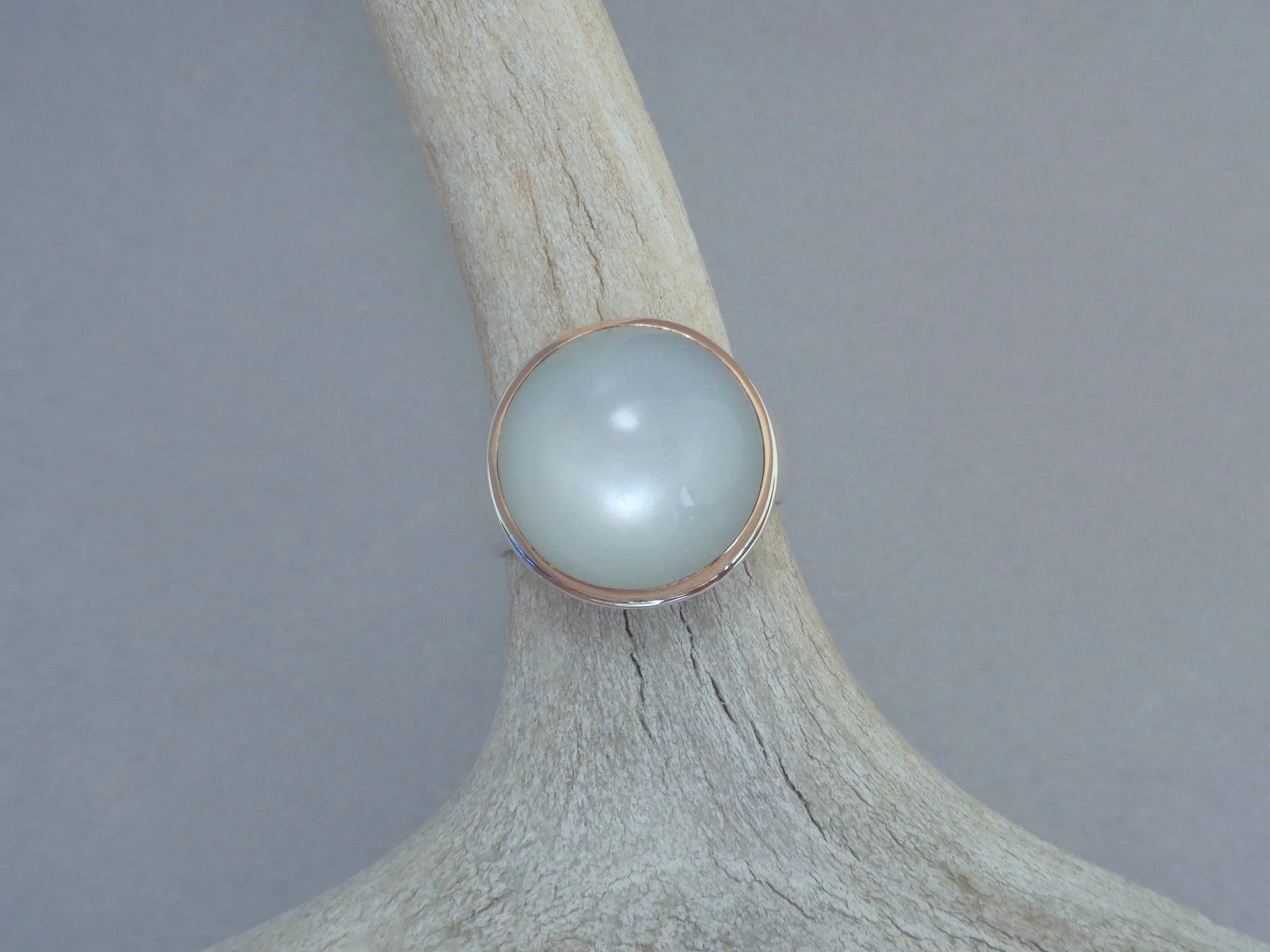silver and rose gold ring with white moonstone x.jpg