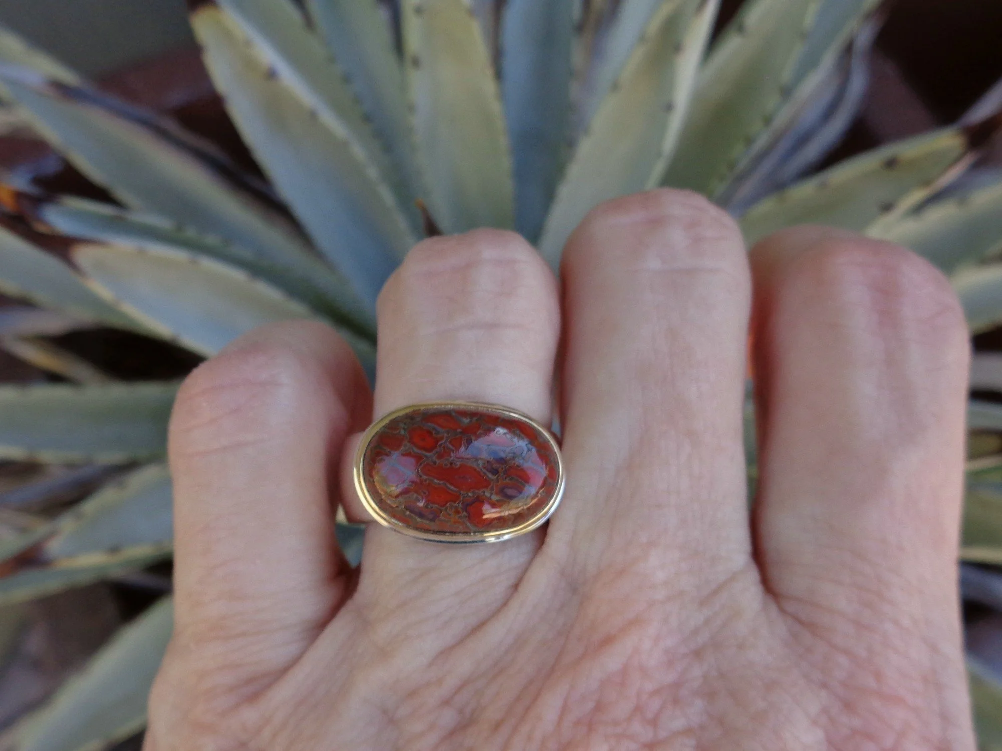 petrified red dinosaur bone ring x.jpg