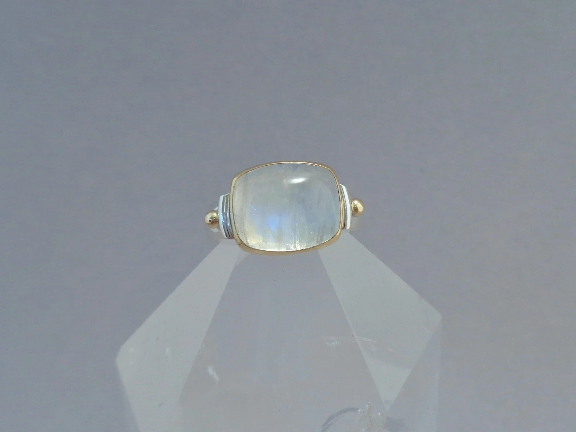 rainbow moonstone in gold and silver ring x.jpg