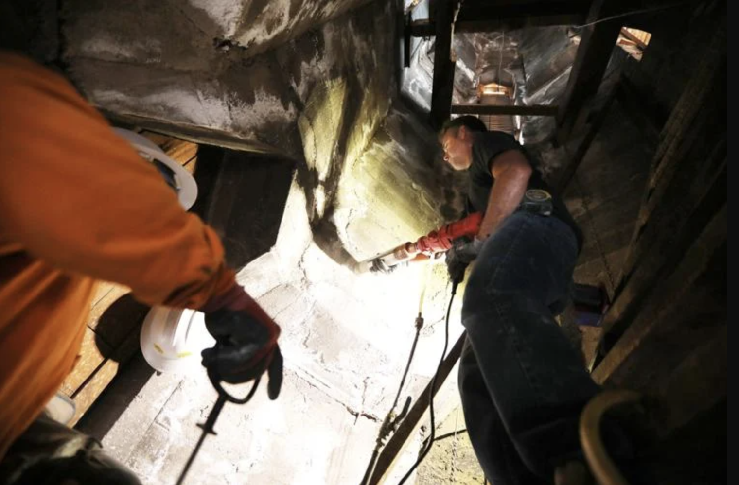  Justin Peak with APC, Another Plumbing Company, takes a concrete core sample from the inside of the tower of the Nativity of the Blessed Virgin Mary chapel.  Jake Bacon, Arizona Daily Sun 