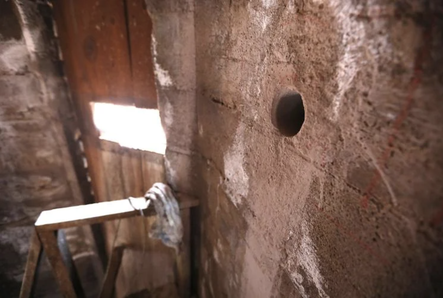  A 3-inch hole in the concrete of the tower at the Nativity of the Blessed Virgin Mary marks where a core sample was drilled as part of an assessment of the strength of both structural and decorative concrete in the building.  Jake Bacon, Arizona Dai