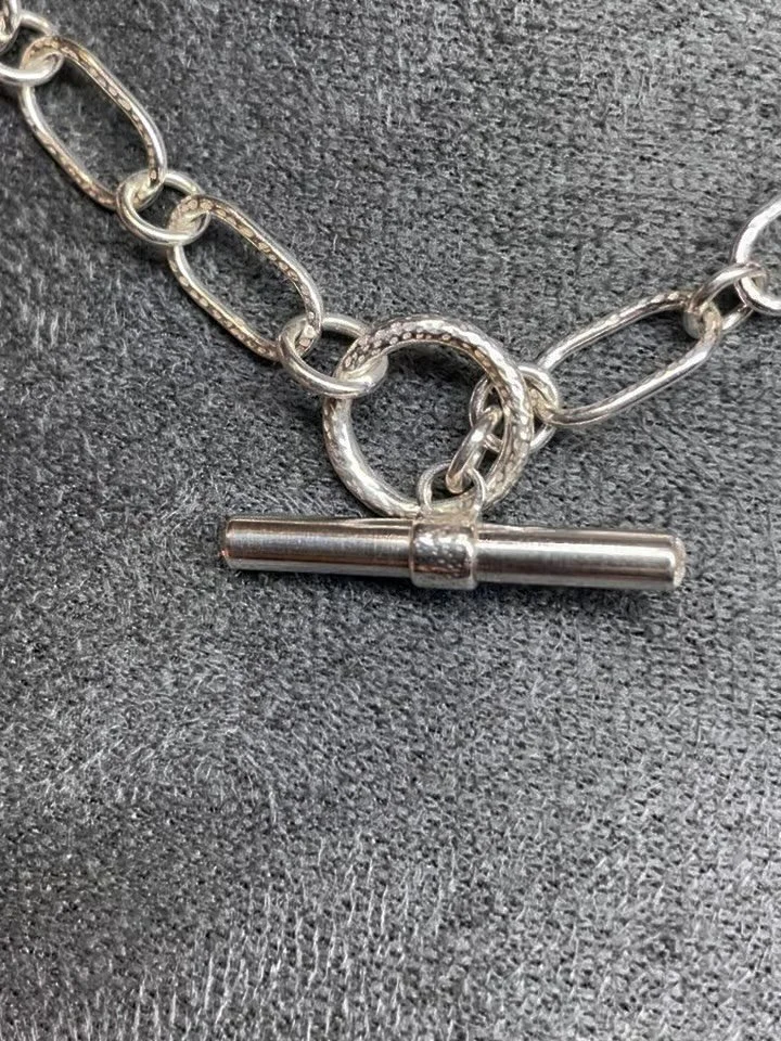 💫One of a kind piece looking for its forever home💫

A classic sterling silver toggle clasp necklace made entirely from handmade chain links. The fronts and backs of the paperclip style links have been textured to give a contrast of finish against t