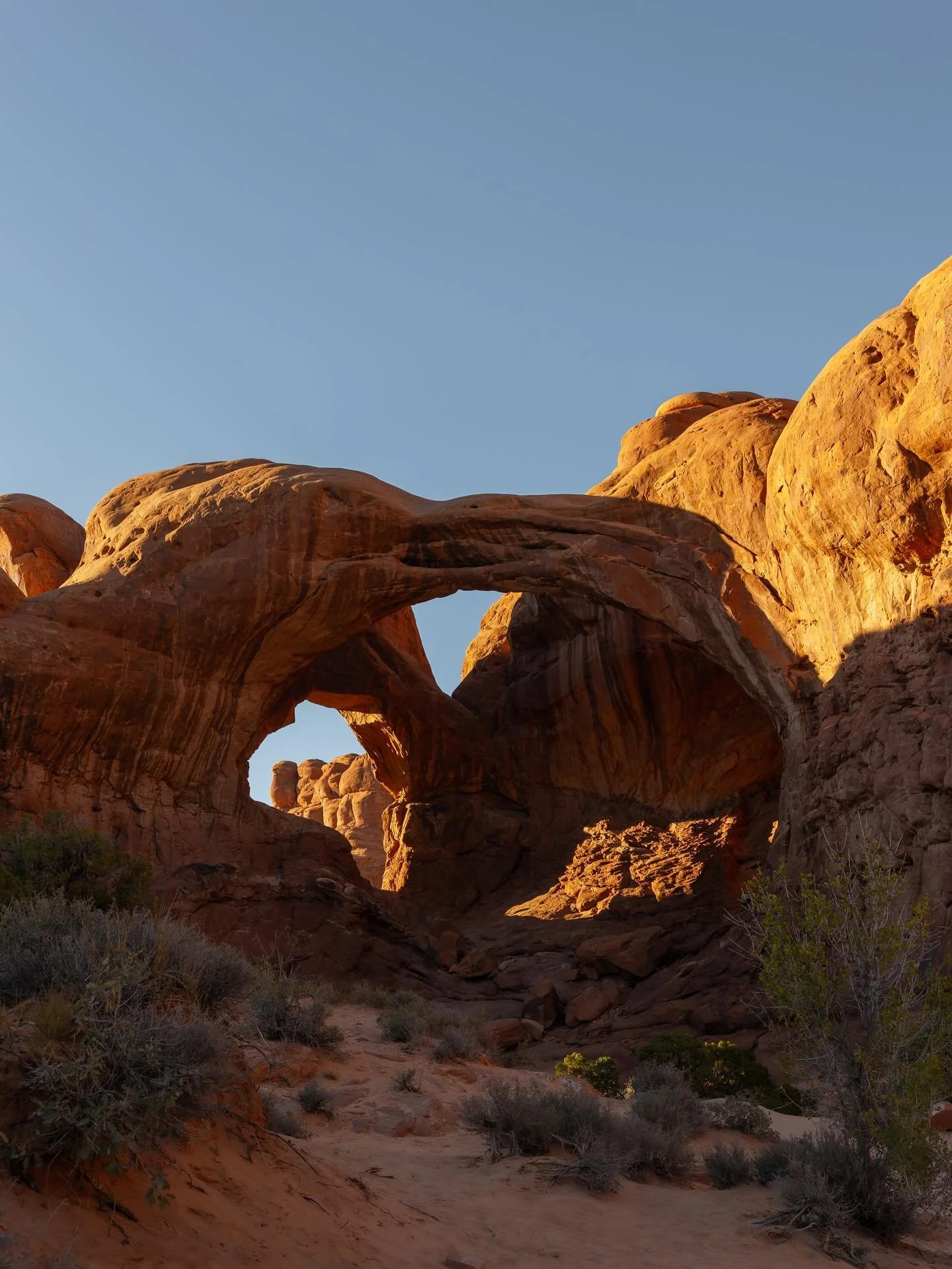 Sunset light on the huge arches of Double Arch! 
Utah &ndash; October 2024

#utah #utahphotographer #archesnationalpark #arches #moab #photography