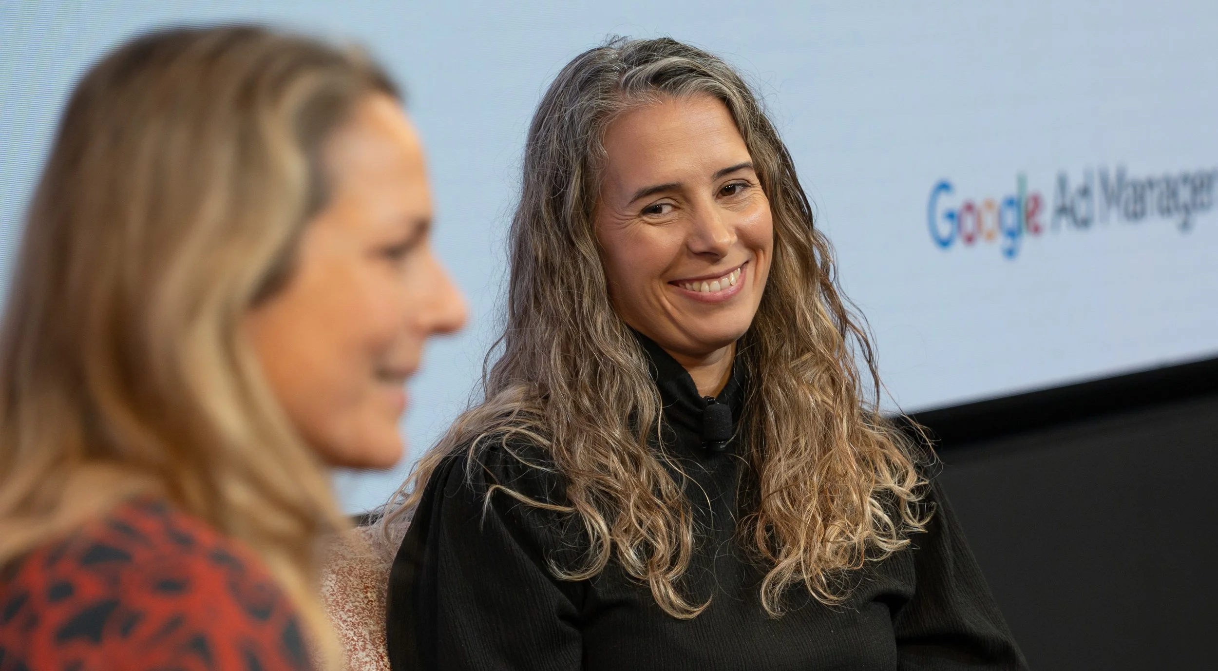 engaged-speaker-on-stage-conference-professional-photographer