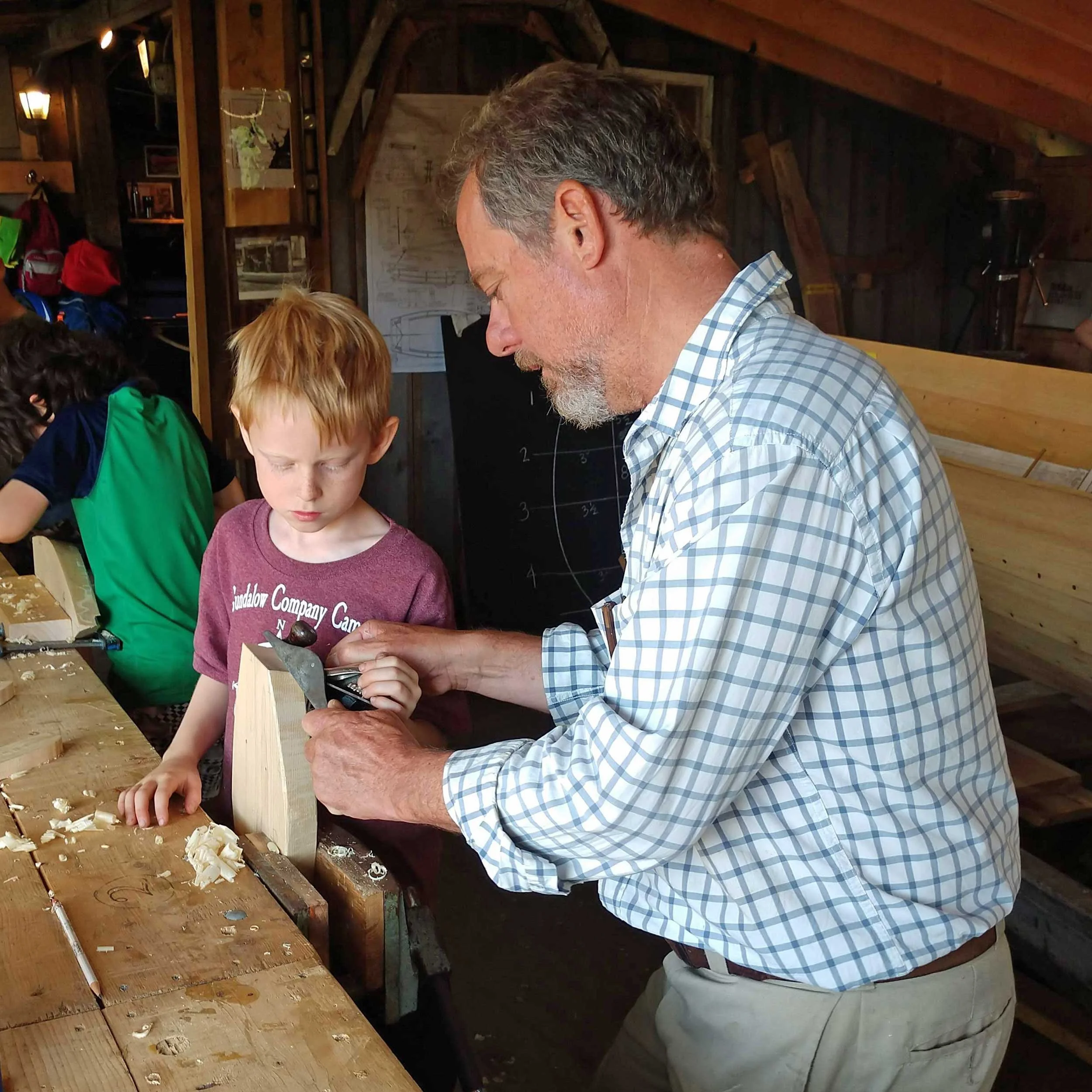 Working-with-a-camper-shaping-a-hull-with-hand-tools.jpg
