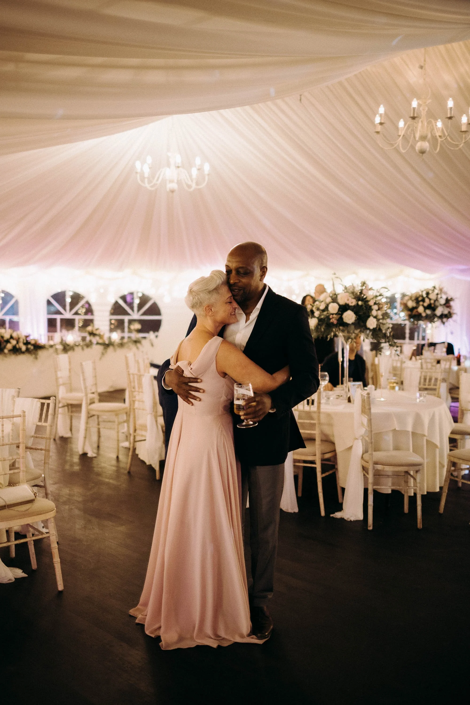 Bride and groom slow dance to the final songs at the end of the night at