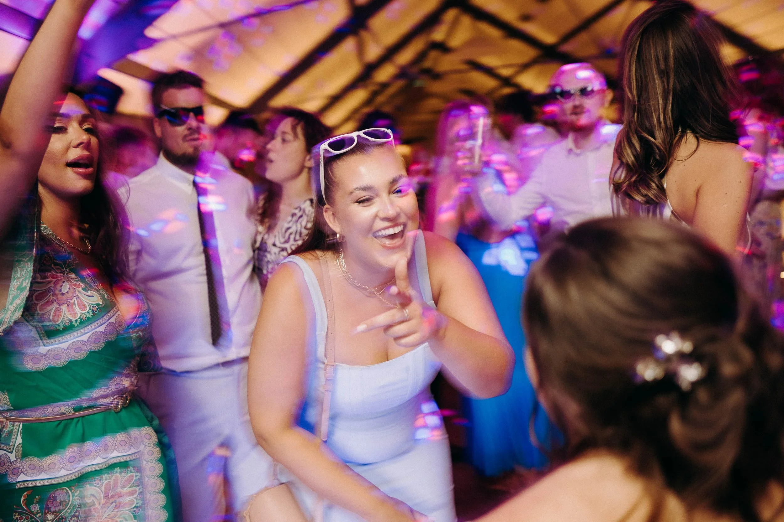 Wedding guests dance during the wedding reception at Grangefields wedding venue.